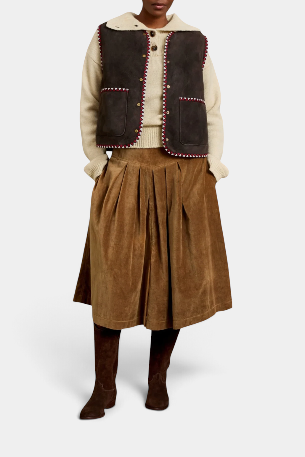 The Copper Shed Lancaster cotton velvet skirt in brown with a pleated design worn with a sweater and vest
