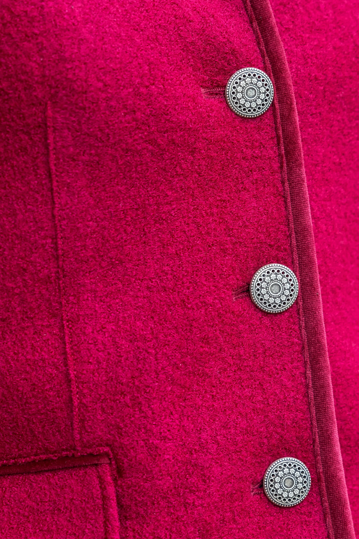 The Copper Shed Lara magenta boiled wool cardigan featuring intricate silver metallic buttons and trimmed edges.