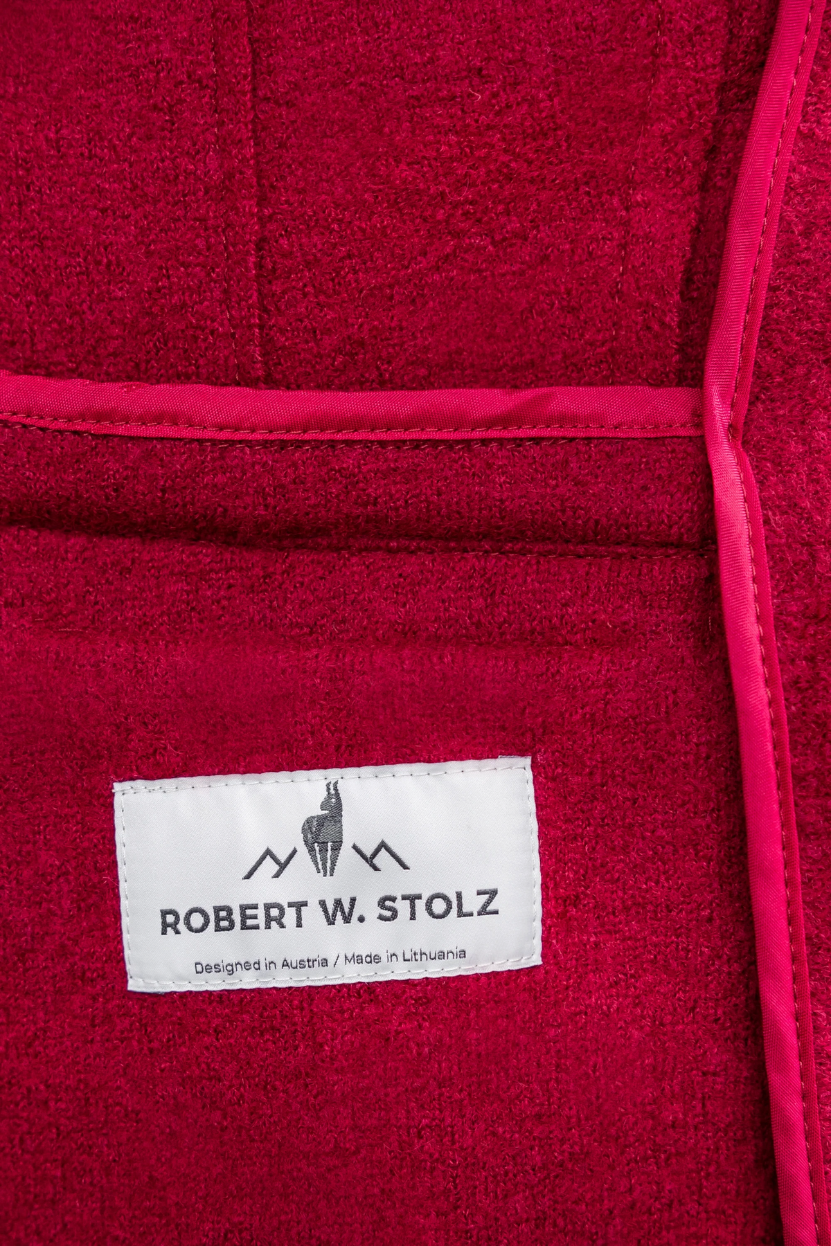 The Copper Shed Lara red felted wool Austrian cardigan featuring a Robert W. Stolz brand label and piped trim