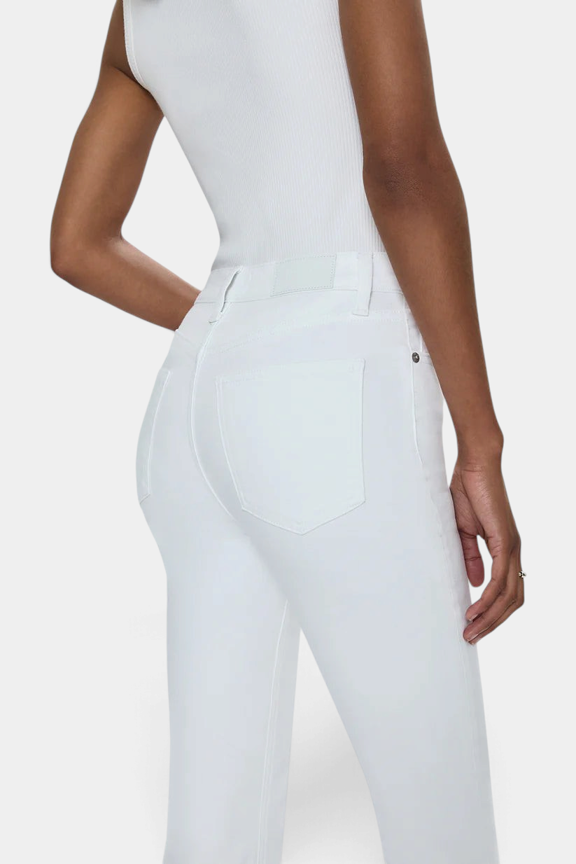 The Copper Shed Lennon high rise white comfort-stretch denim jeans on a model, back view showing pocket detail.