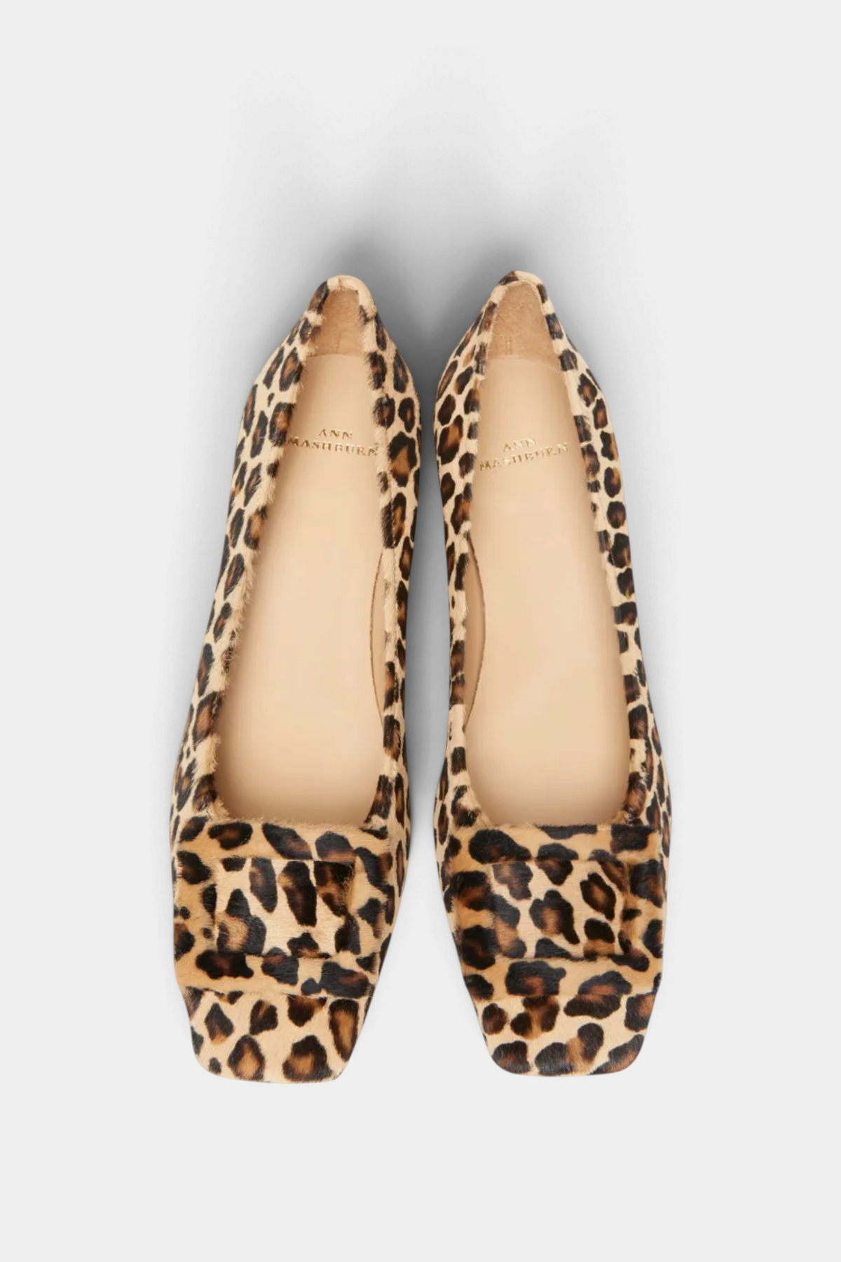 The Copper Shed leopard print leather buckle heels with a square toe and cushioned insole, top-down view.