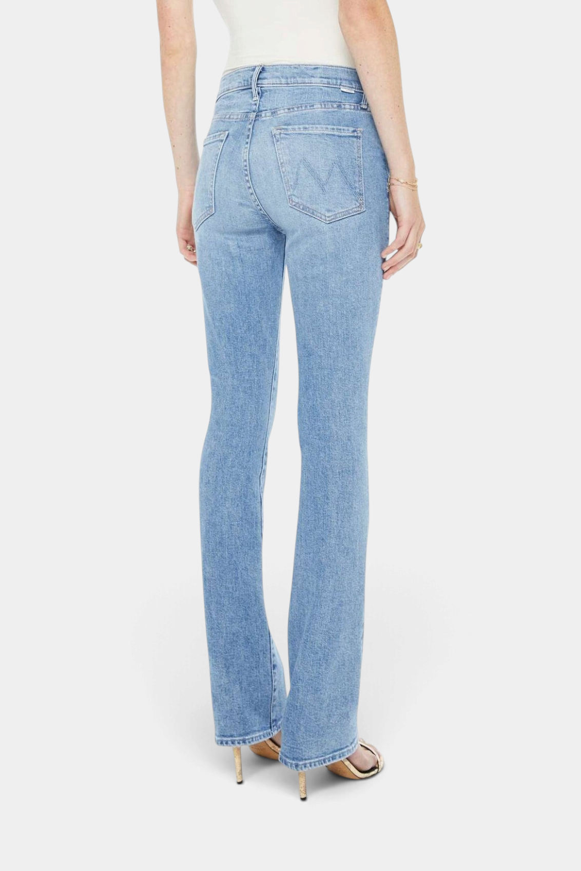 The Copper Shed The Insider Skimp light blue high-waisted bootcut denim jeans, back view with clean hem.