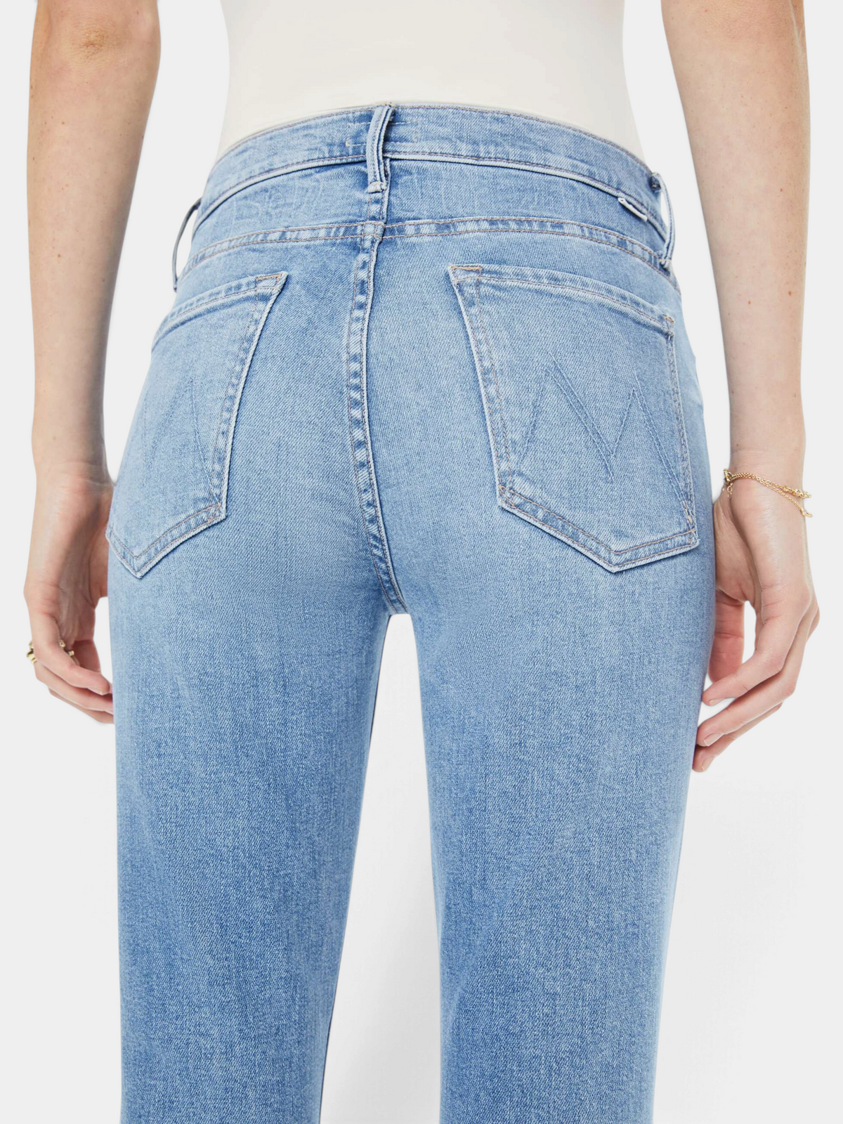 The Copper Shed The Insider Skimp high-waisted light blue stretch denim bootcut jeans, back view.