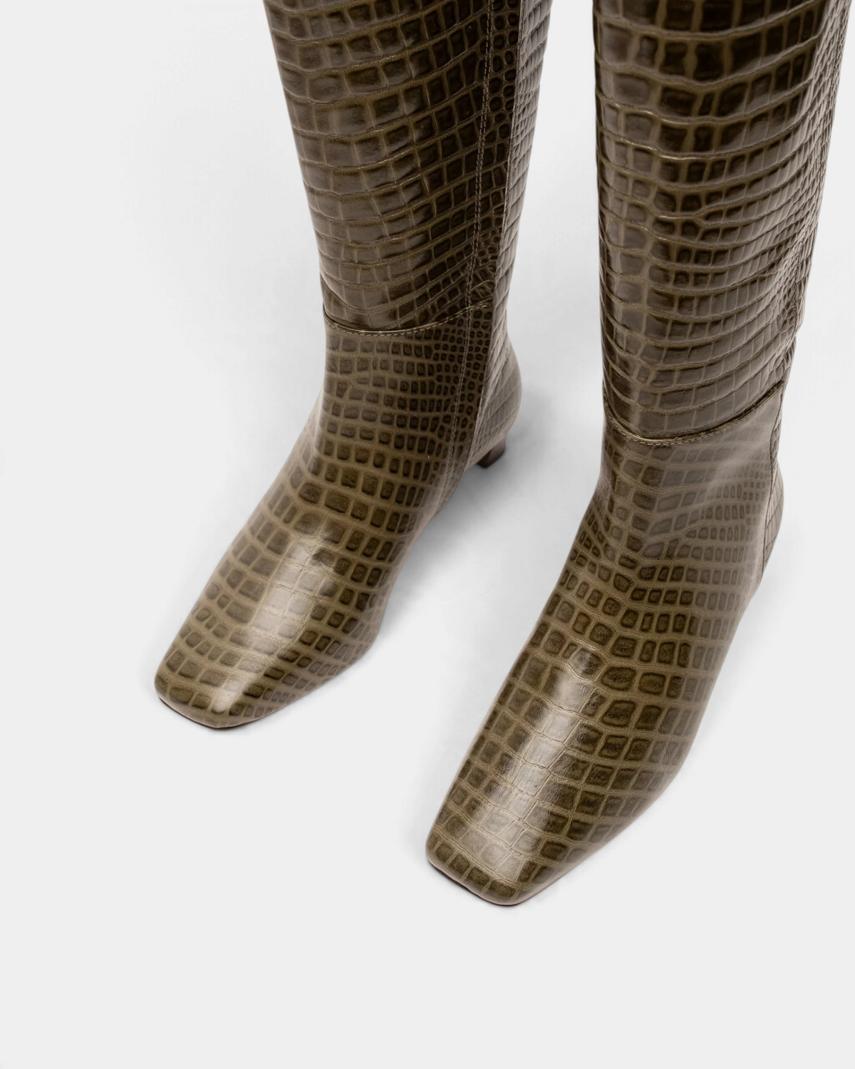 The Copper Shed Mackie knee-high boots in olive green croc-embossed leather with a square toe and low block heel.
