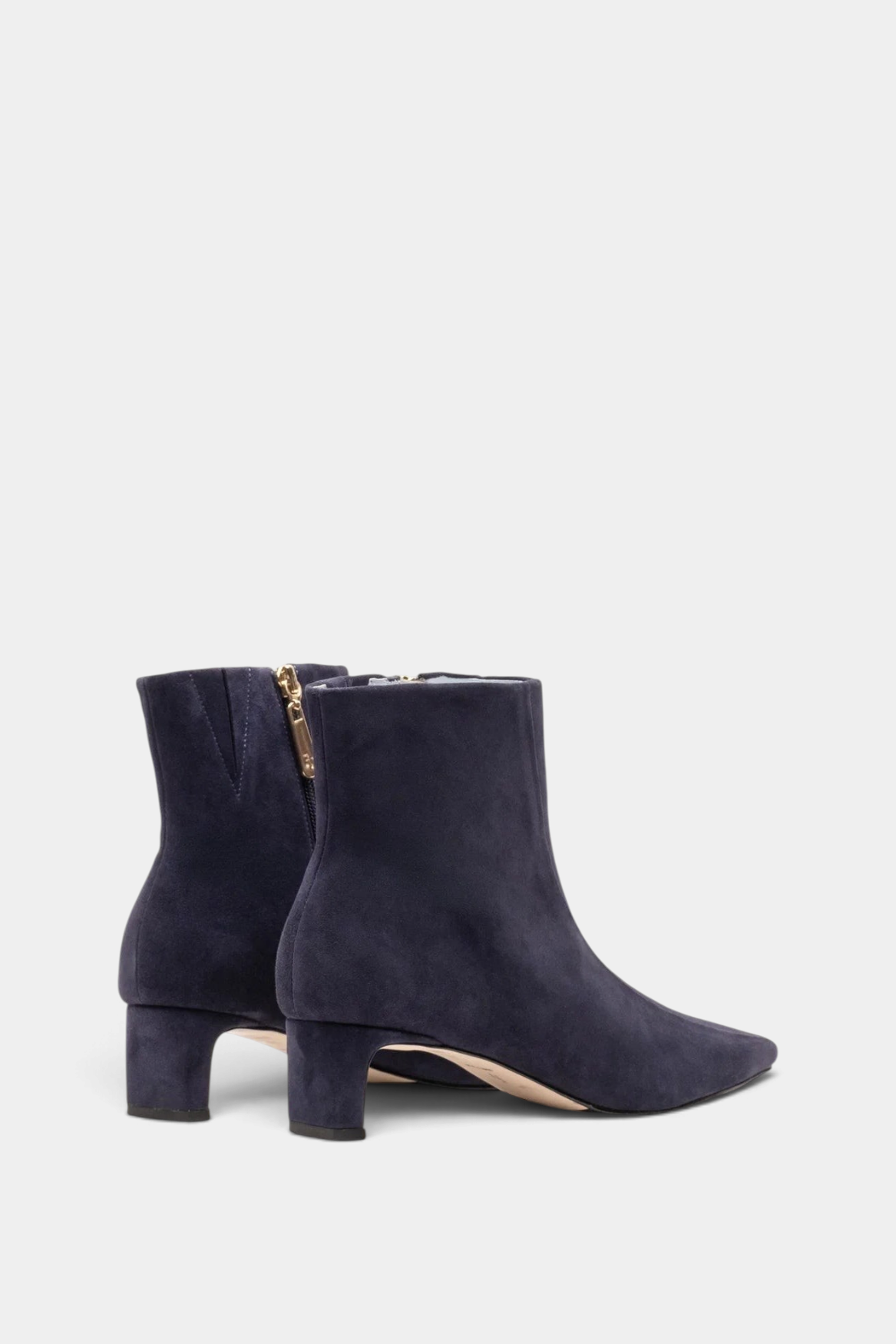 The Copper Shed Marianne navy blue stretch suede ankle boot with a two-inch block heel and side zipper detail.