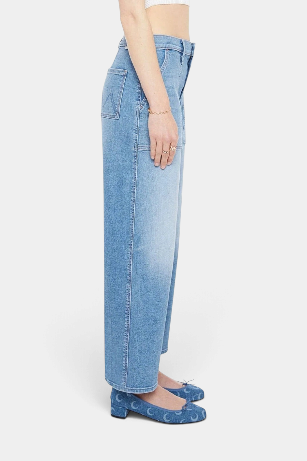 The Copper Shed Maven Flood high-waisted wide-leg jeans in light blue stretch denim with patch pockets, side view.