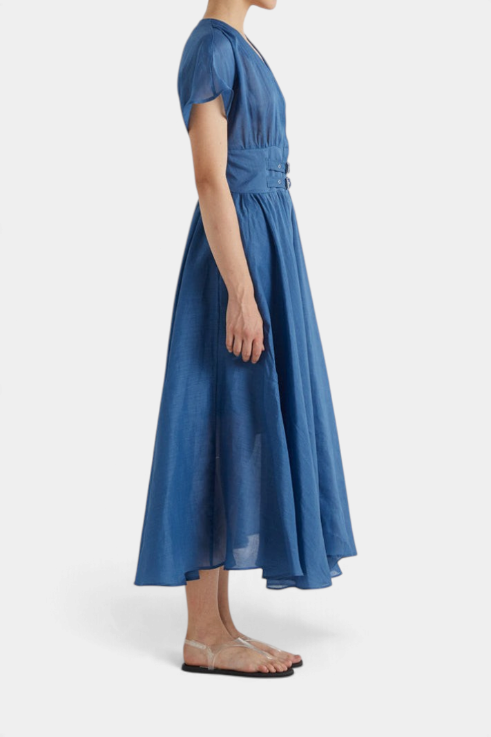 The Copper Shed MeiMeiJ blue flared dress with v-neck, buckled waist straps, and cap sleeves, side view