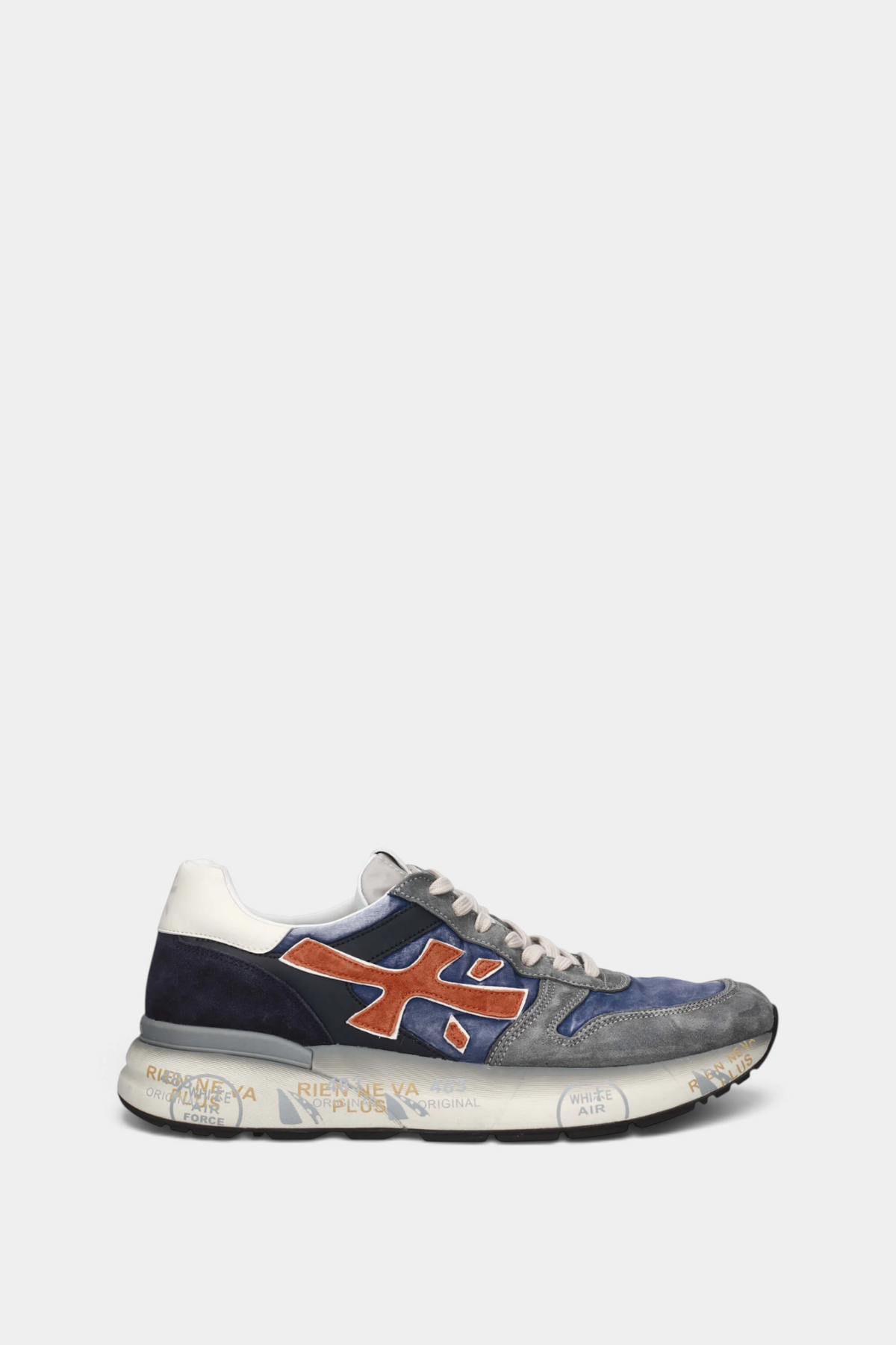 The Copper Shed Mick 7215 sneaker in blue and grey suede with a bold orange logo and vintage-effect printed sole.