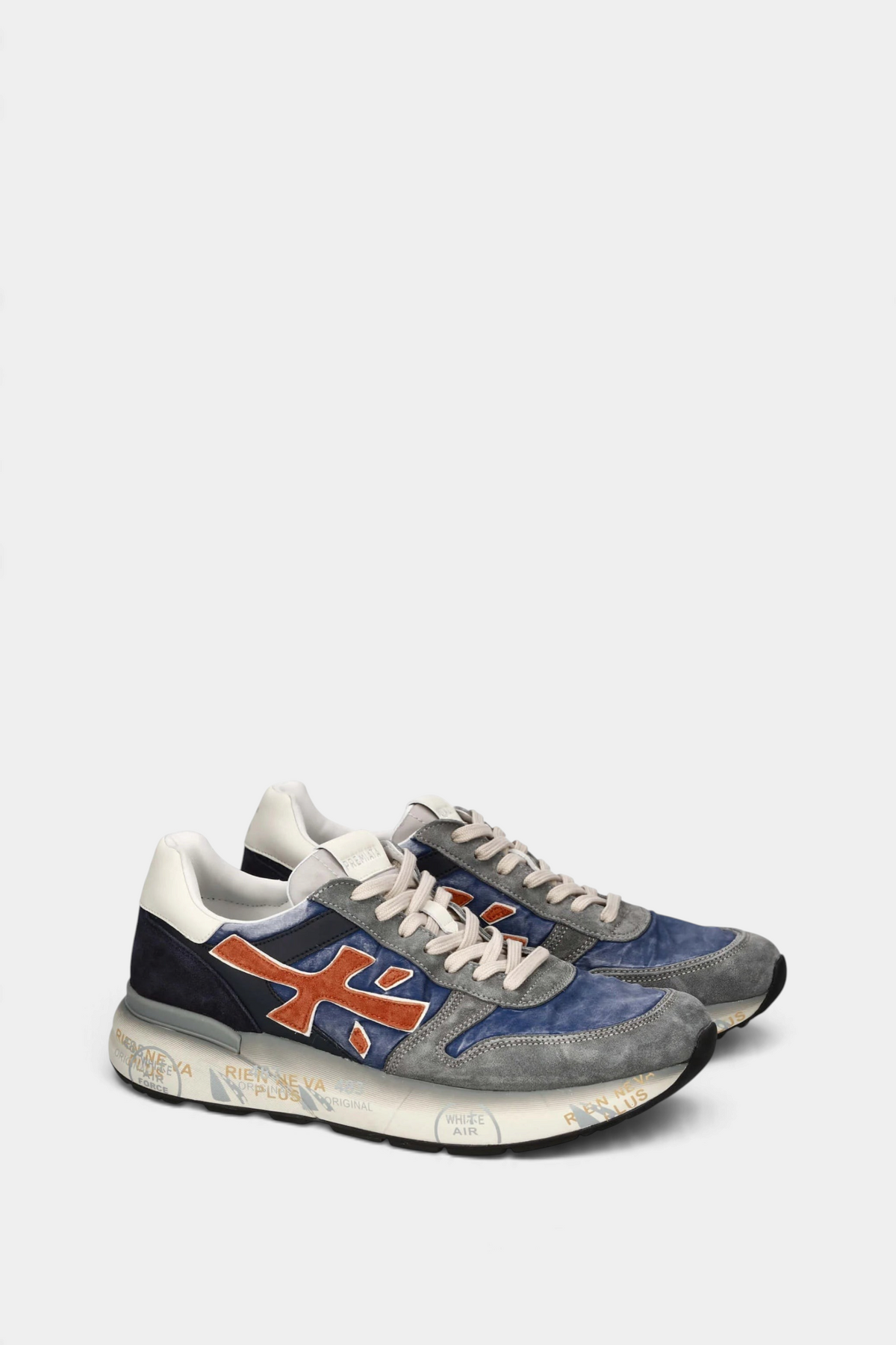 The Copper Shed Mick 7215 sneakers in blue and grey suede with orange logo accents and a vintage-effect sole.