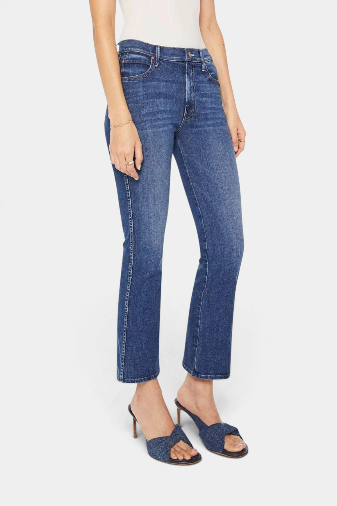 The Copper Shed mid-rise flared jeans in dark blue stretch denim with whiskering and a clean hem