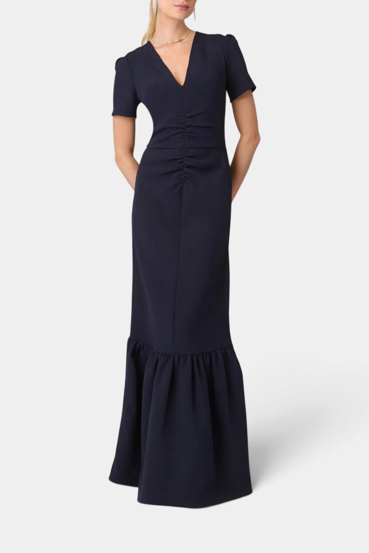The Copper Shed Midnight Tracy Dress in navy crepe with a V-neck, pleated sleeves, and a flounced hemline.