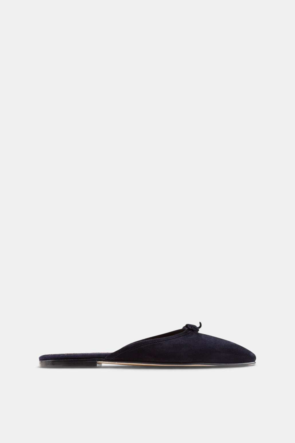 The Copper Shed Joy mule in navy kid suede with a tapered almond toe, small bow detail, and low 10mm heel.
