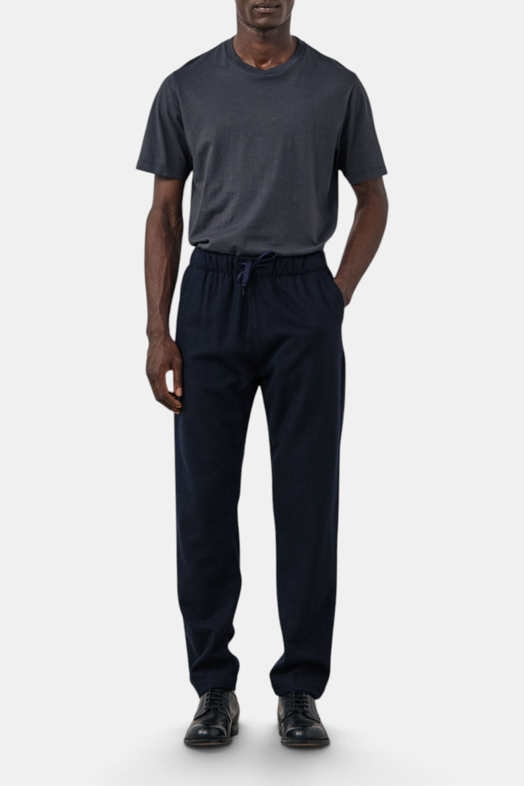 The Copper Shed navy boiled wool flannel jogger pants with an elastic drawstring waist and straight-leg fit.