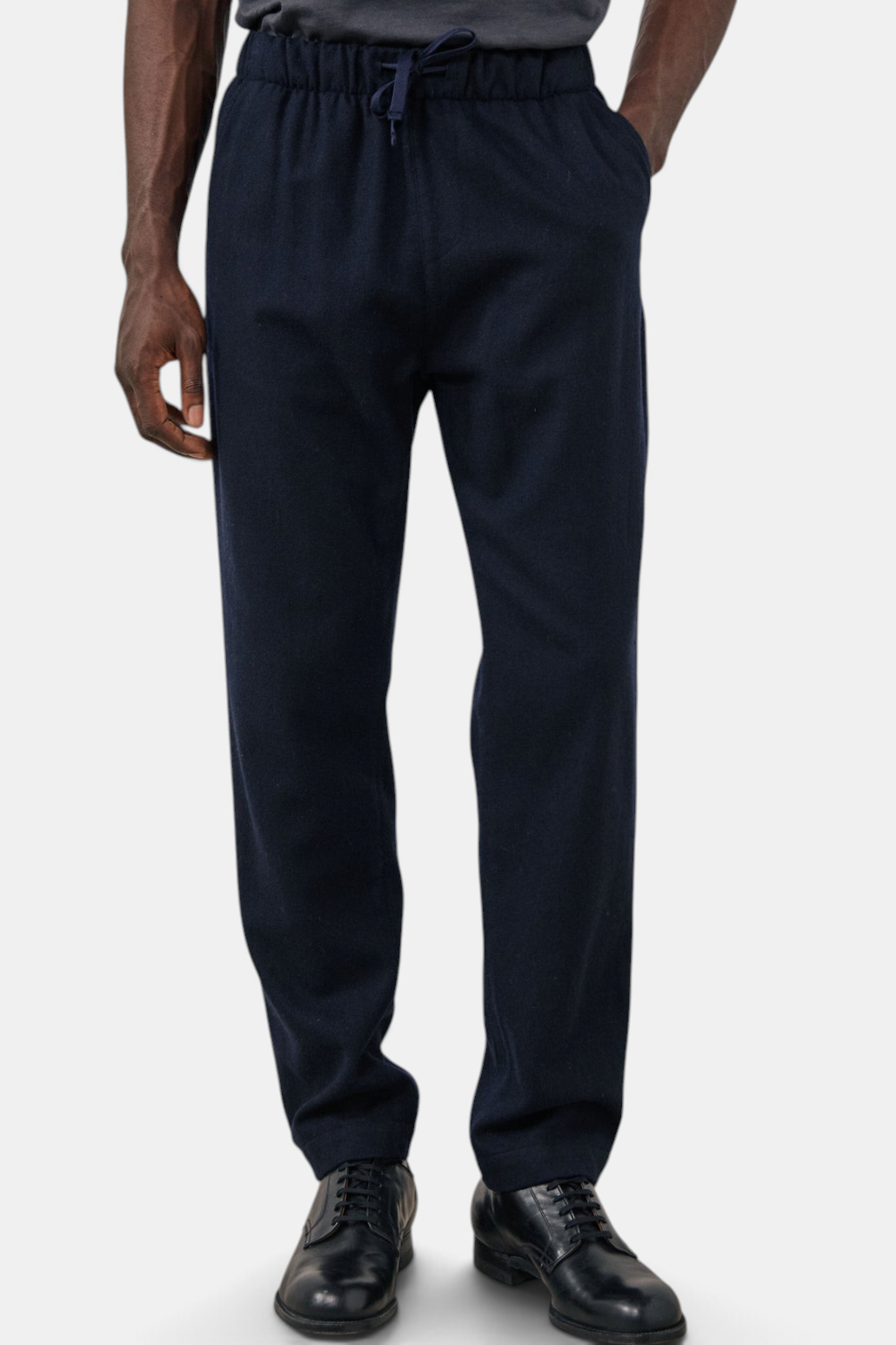 The Copper Shed navy blue boiled wool flannel jogger pants with an elastic drawstring waist and straight-leg fit.