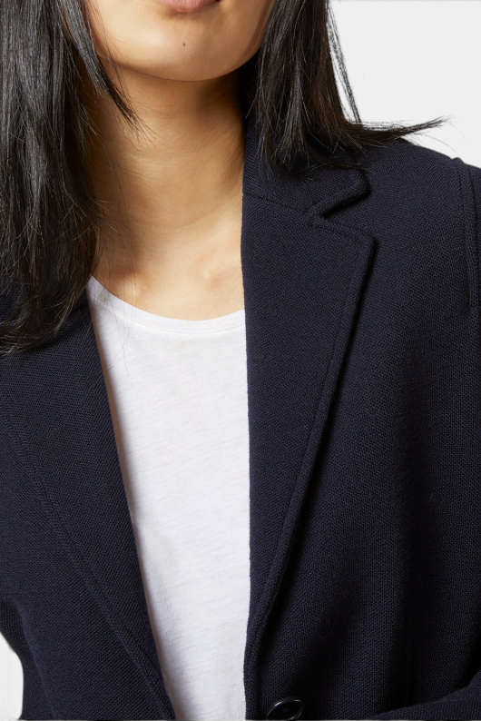 The Copper Shed navy blue wool pique blazer with a slim, unlined fit and classic lapel detail