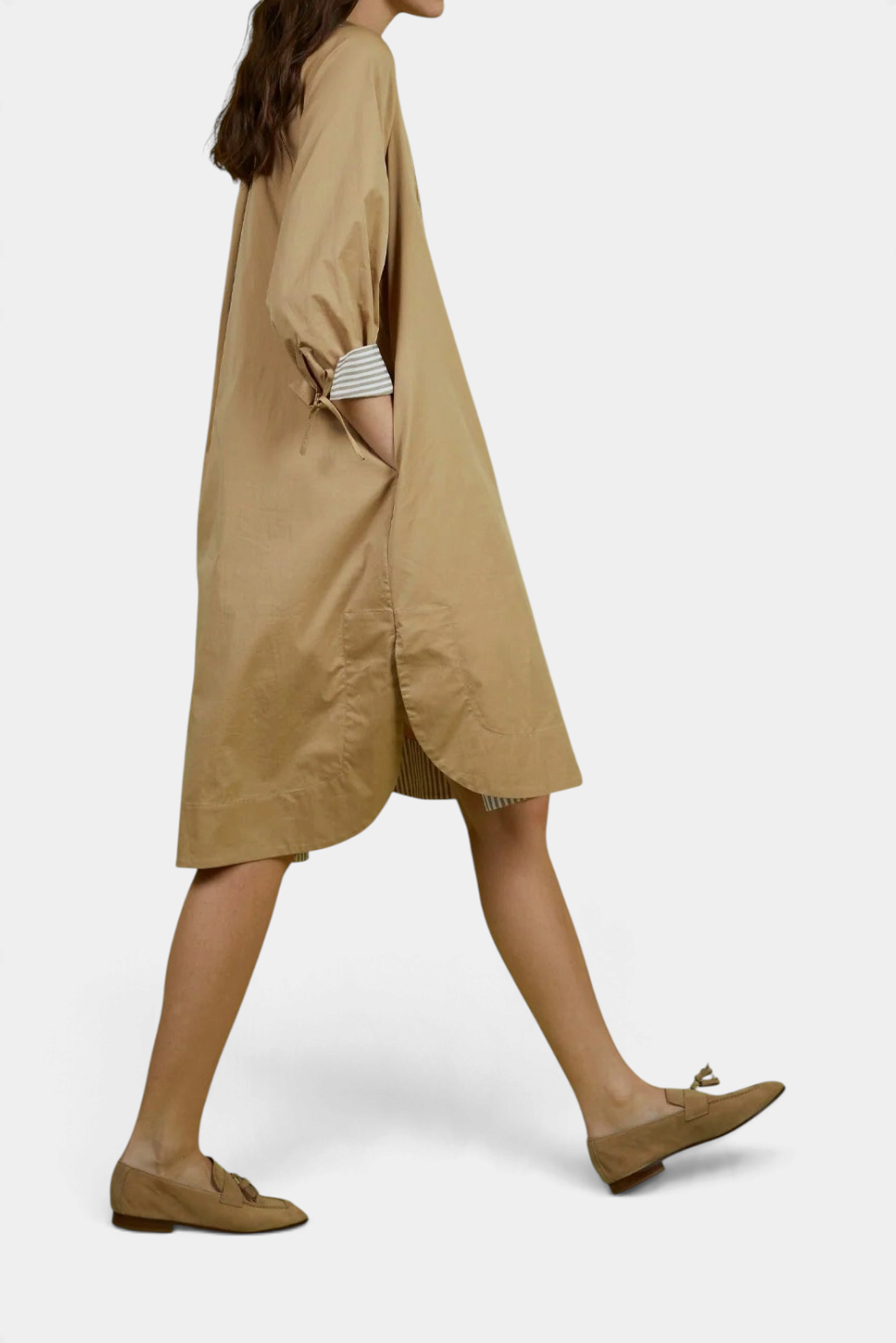 The Copper Shed Noemi shift dress in tan cotton with a gathered neckline and billowed sleeves, side view