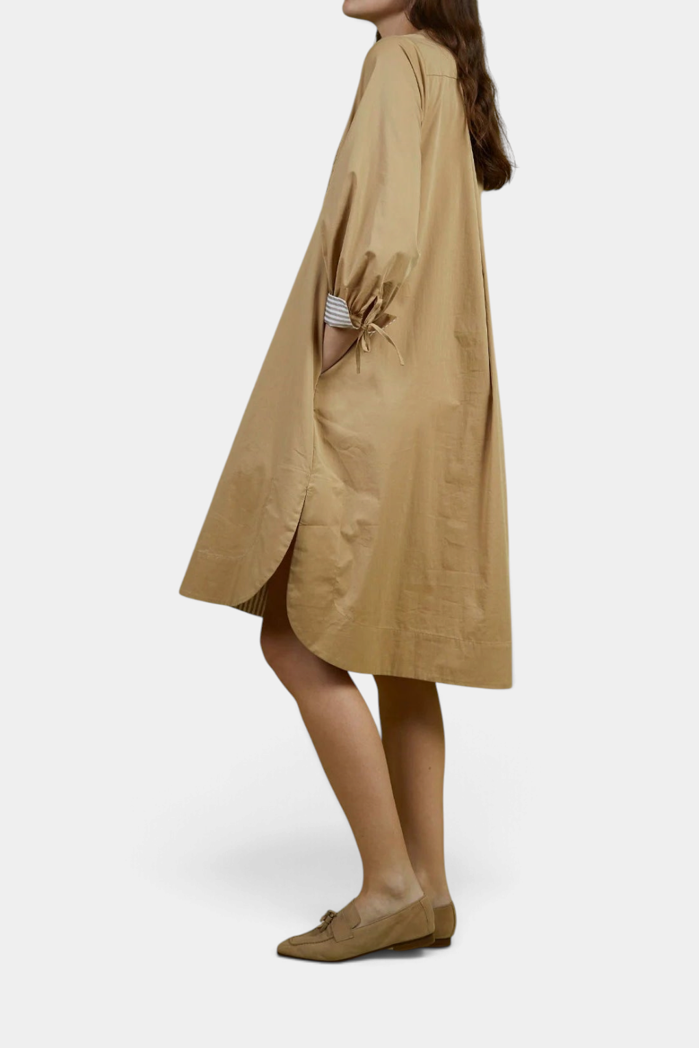 The Copper Shed Noemi shift dress in tan cotton with billowed sleeves and a relaxed silhouette, side view