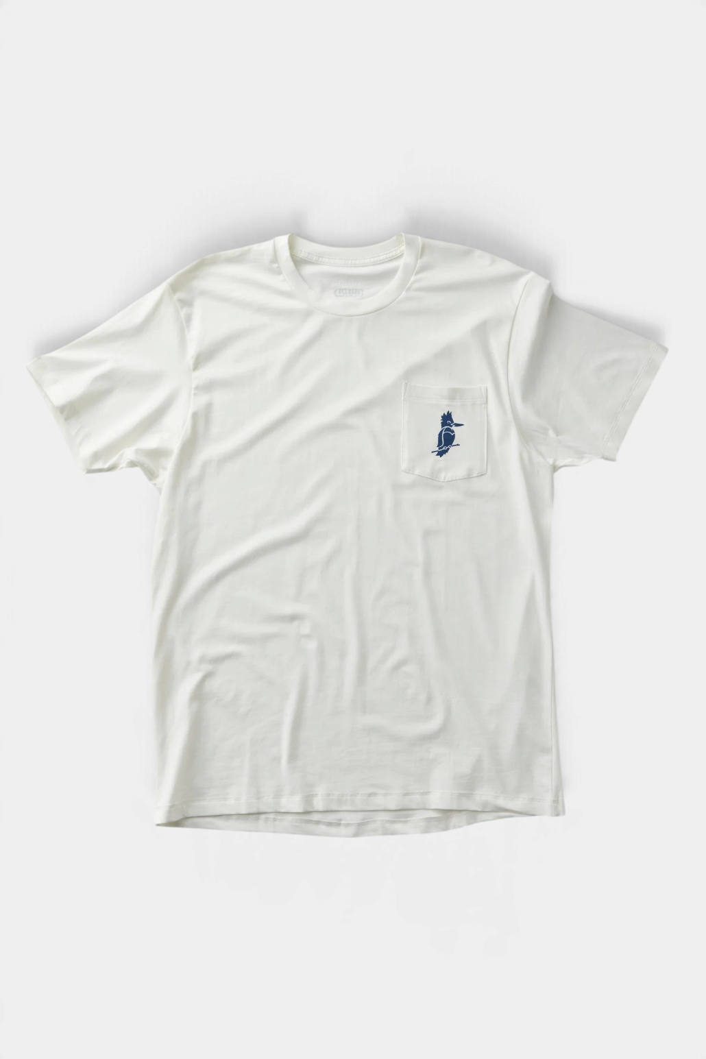 The Copper Shed Petey Pocket Tee in off-white organic cotton with a blue bird graphic on the chest pocket