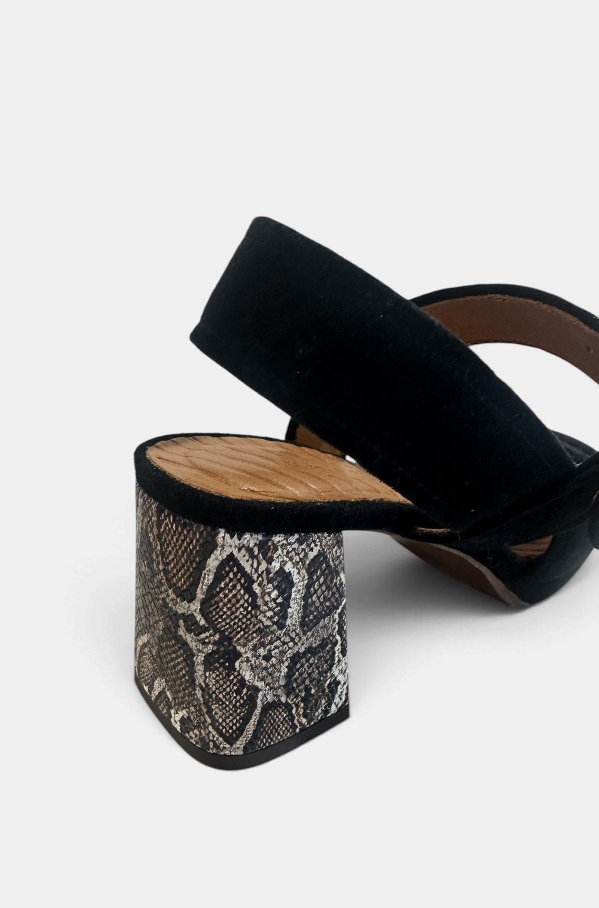 The Copper Shed Ogiki heel featuring a black suede strap and a snakeskin patterned block heel