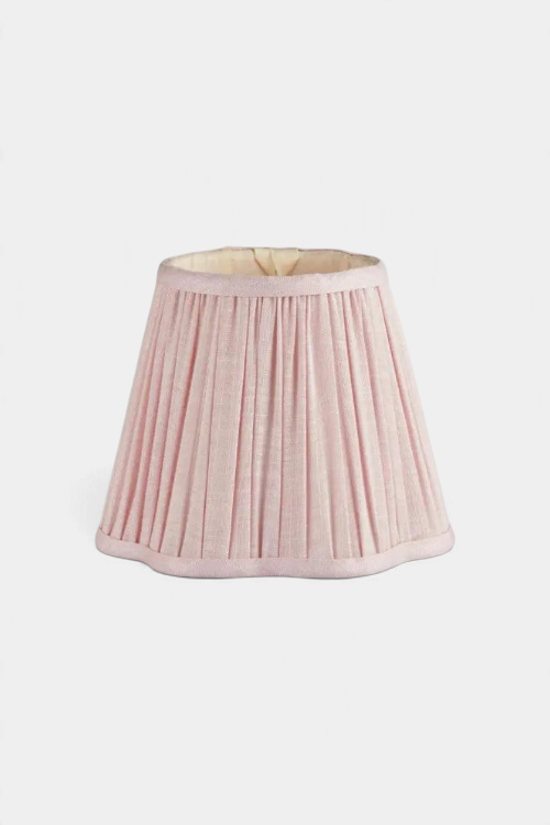The Copper Shed scalloped lampshade in soft pink pleated linen-viscose fabric with a contemporary curved edge.