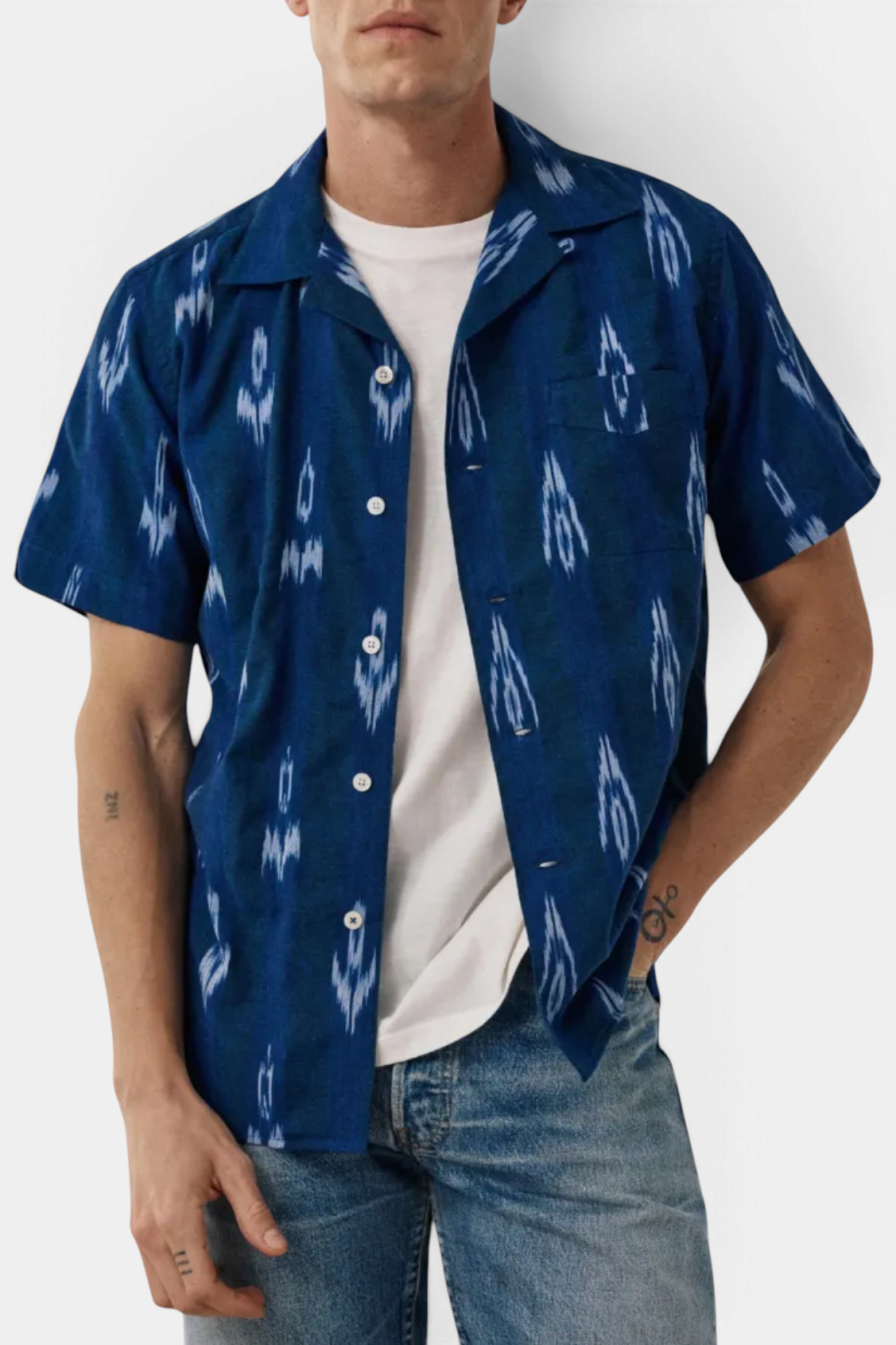 The Copper Shed Palmito shirt in indigo cotton with a traditional Ikat print, Cuban collar, and mother-of-pearl buttons