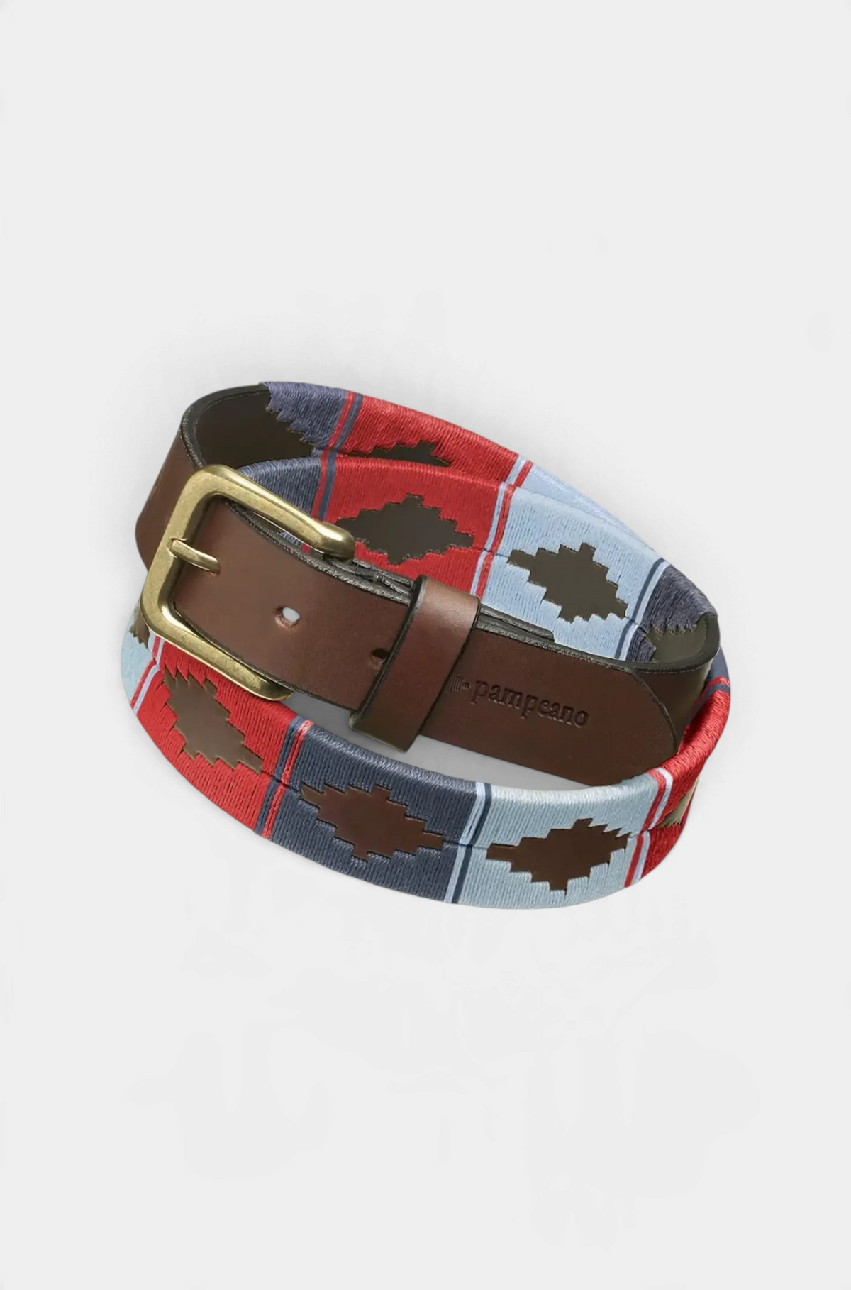 The Copper Shed Pampeano hand-stitched leather polo belt in red, light blue, and grey with a brass buckle.