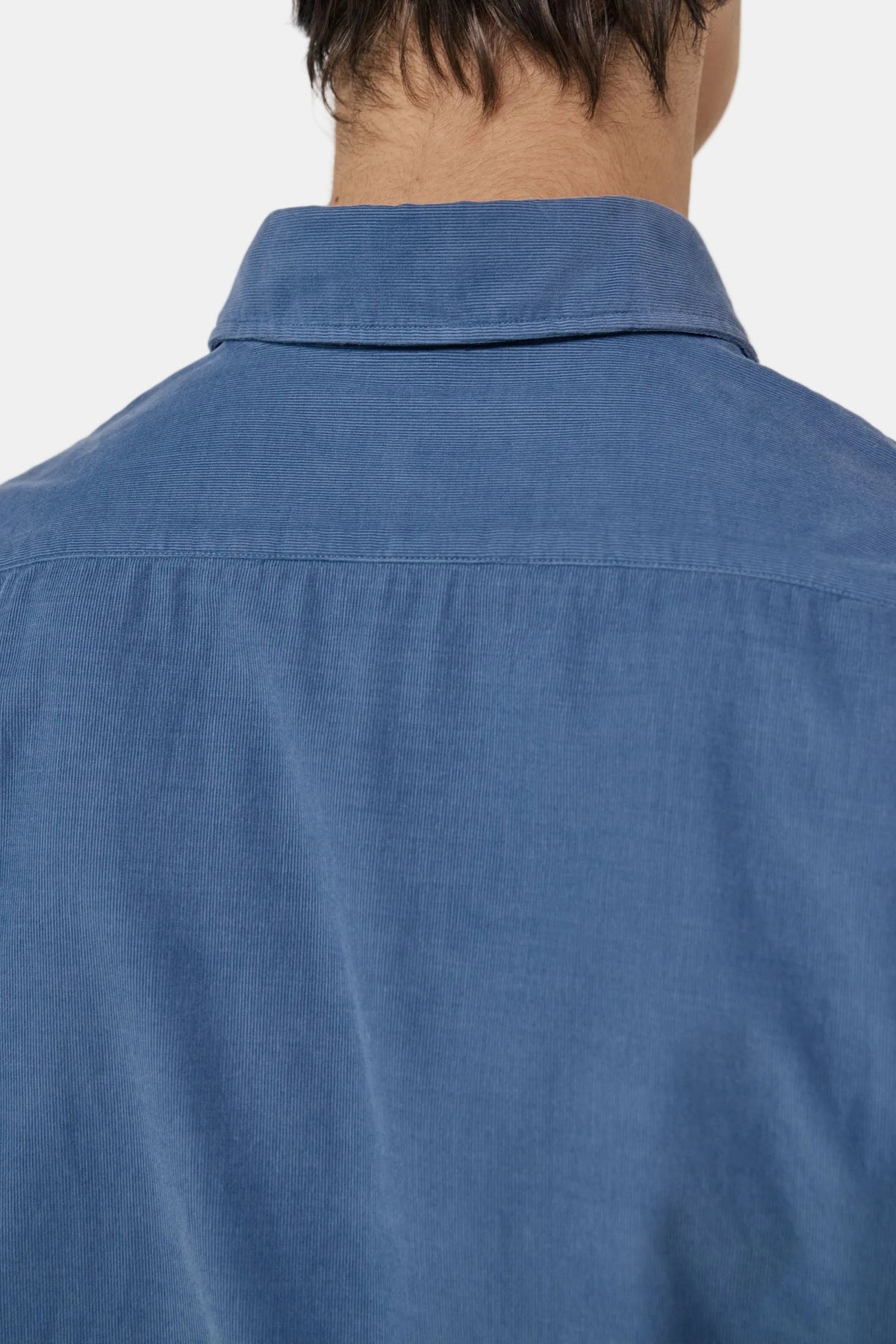 The Copper Shed blue fine corduroy shirt back view showing collar and yoke detail