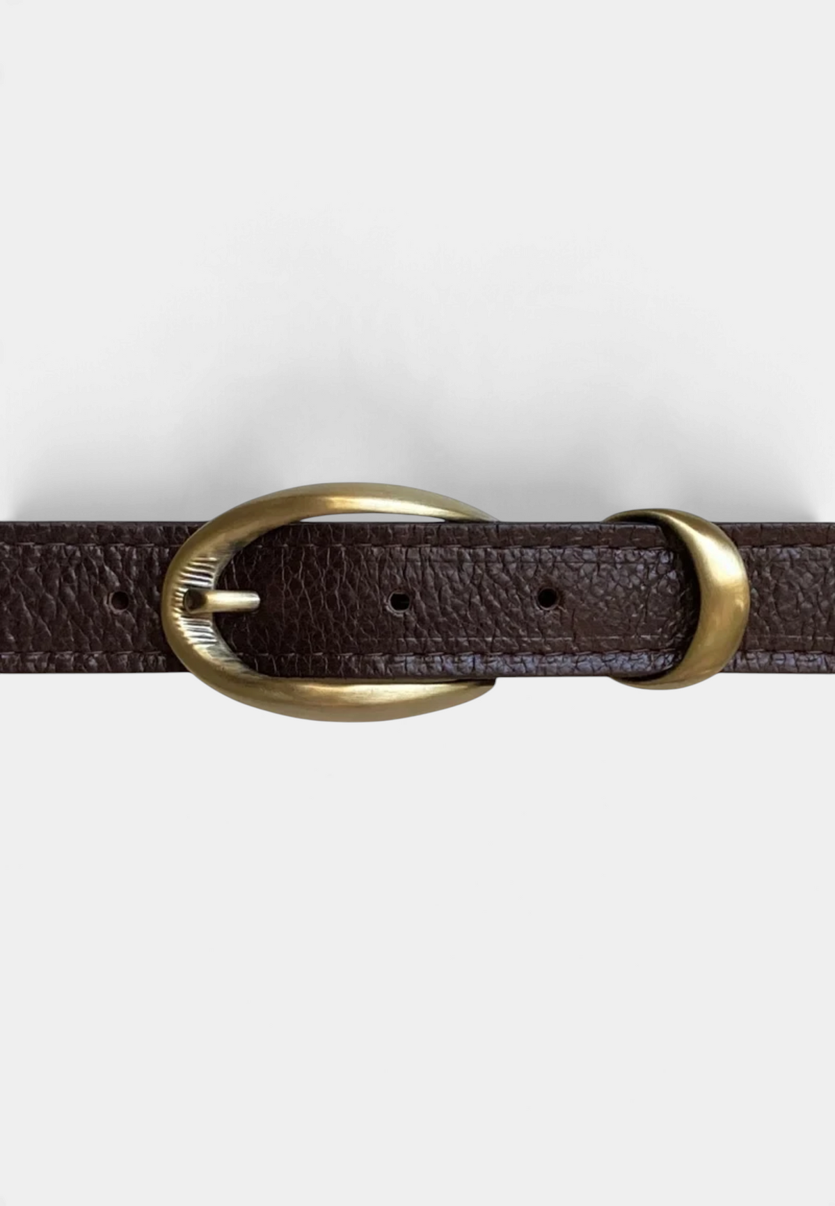 The Copper Shed black pebbled leather belt with an etched antique brass buckle and cast keeper detail.