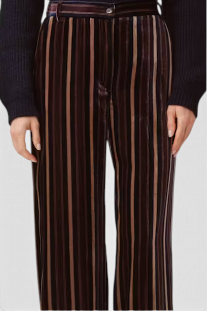 The Copper Shed Piedro trousers in striped velvet with a relaxed, fluid fit and dark multi-coloured vertical stripes.