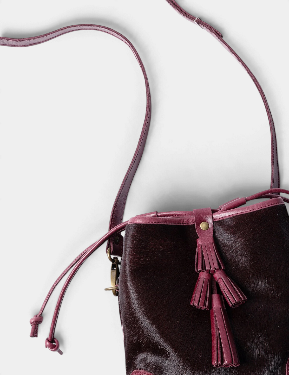 The Copper Shed dark cherry long-haired pony cowhide Fortune Teller bag with tiered leather tassel and crossbody strap