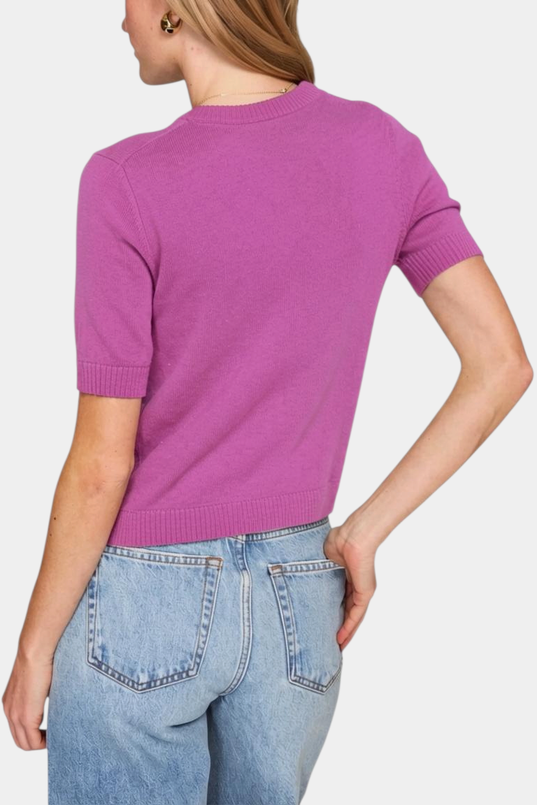 The Copper Shed purple short-sleeve cropped cashmere crew neck sweater with ribbed trim worn by a model