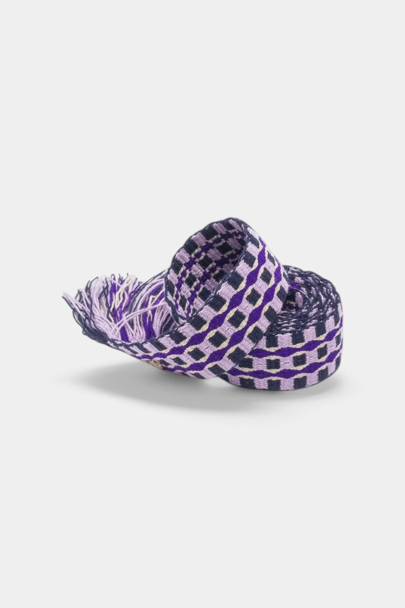 The Copper Shed hand-woven purple and black patterned belt with fringe detail, crafted by artisans in Colombia.