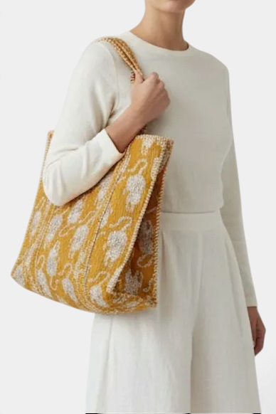 The Copper Shed reversible quilted cotton tote bag with a vibrant yellow and white floral block print pattern.