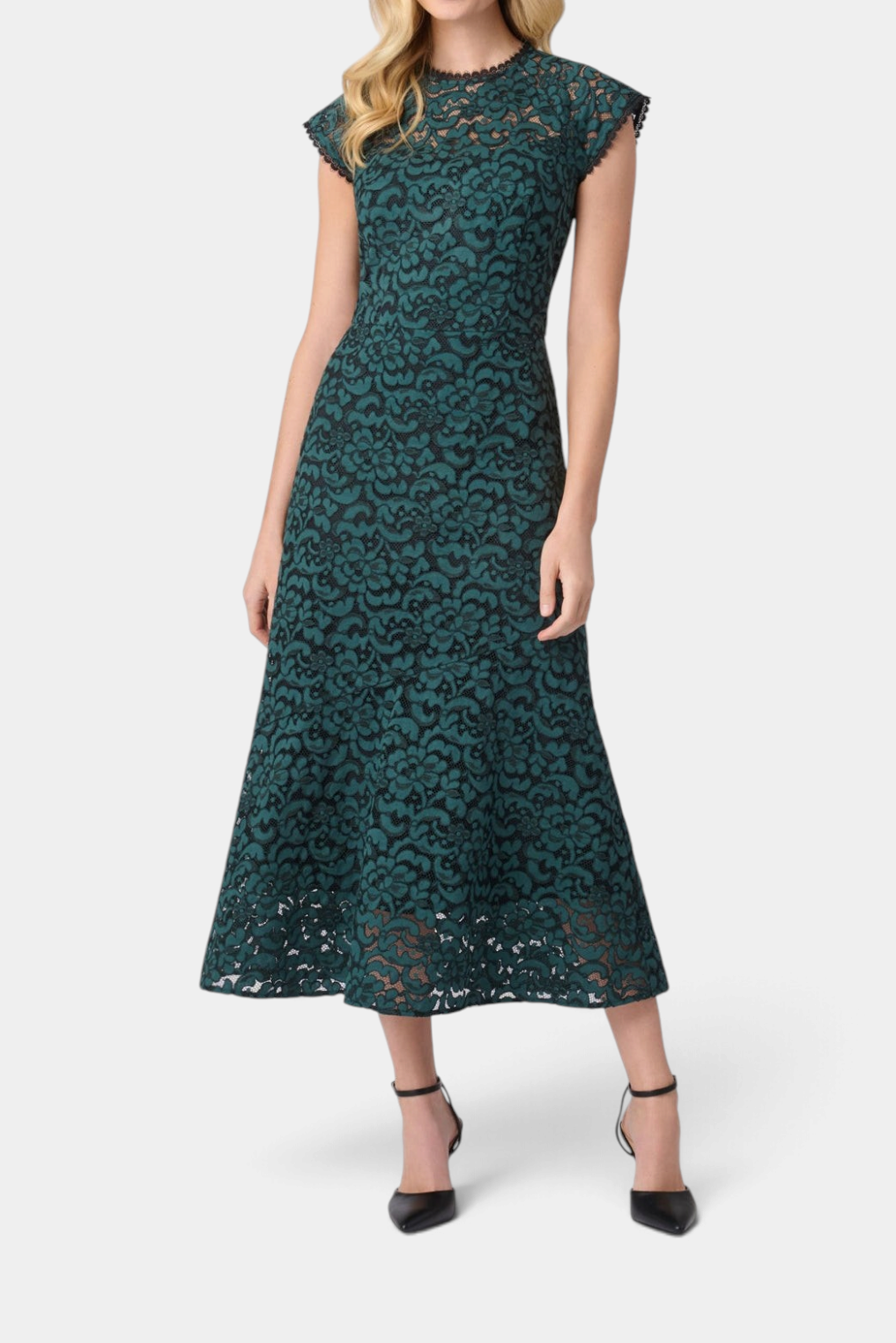 The Copper Shed Raven midi dress in dark green lace with an illusion neckline, cap sleeves, and a flared hem.