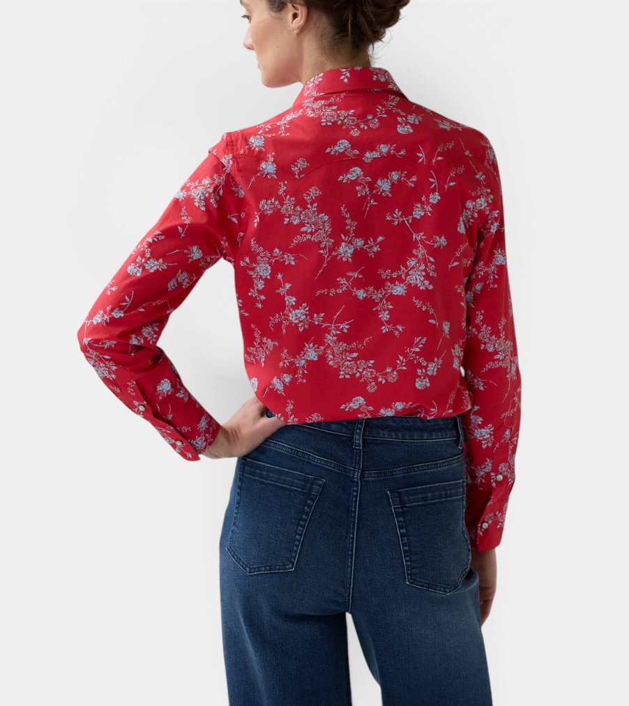 The Copper Shed Western Shirt in red Liberty Fabrics floral cotton poplin with a pointed back yoke, worn by a model.