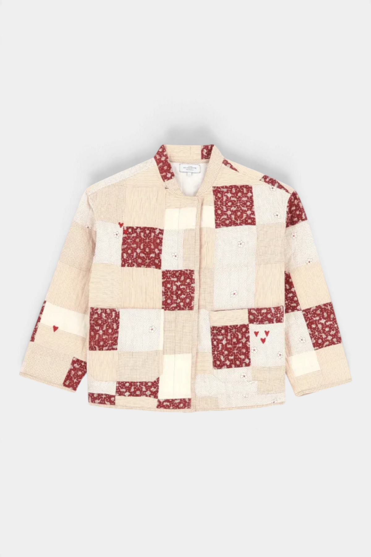 The Copper Shed red and cream patchwork cotton jacket with quilted Kantha-style manual stitching and heart details.
