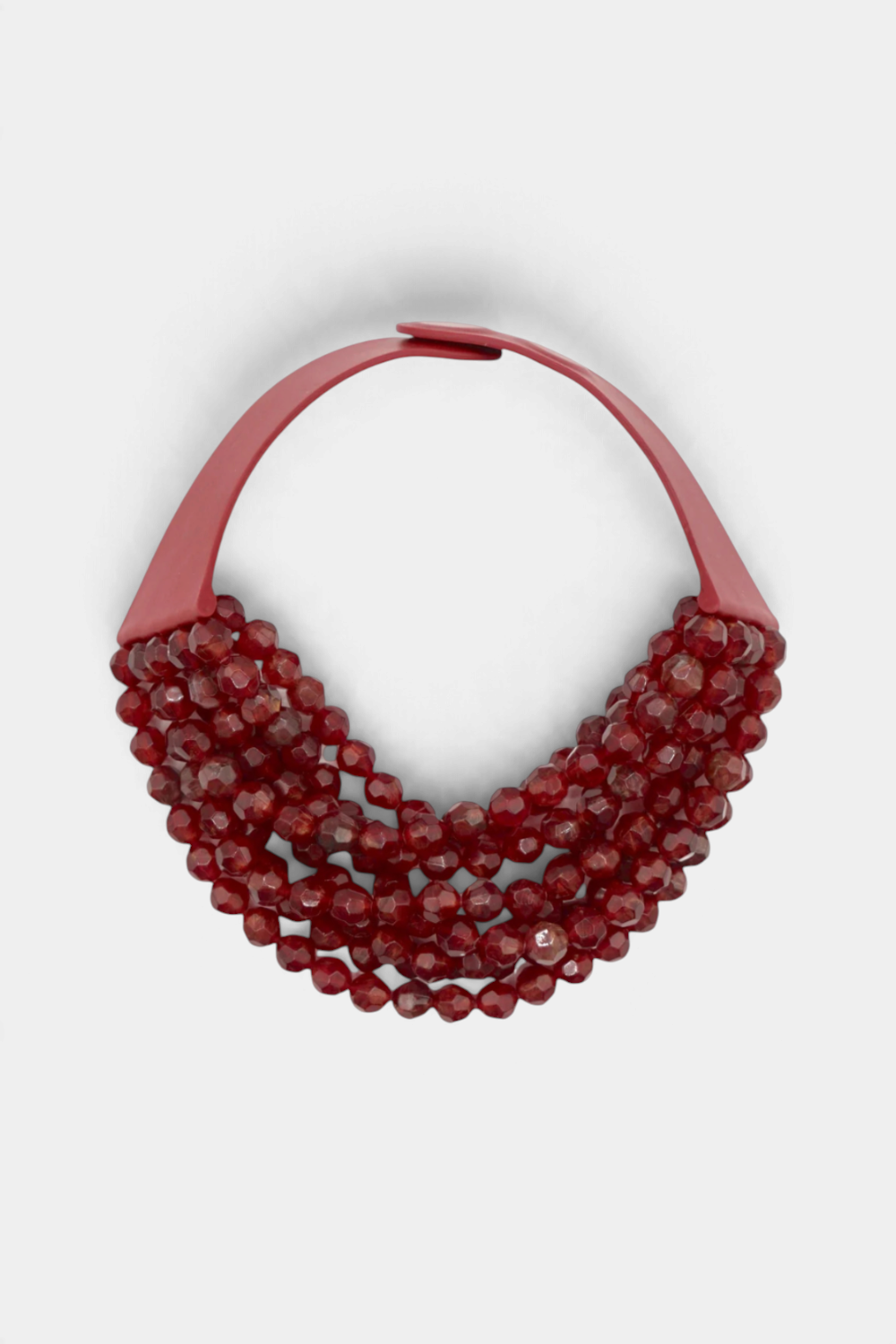 The Copper Shed Bella Grace multi strand necklace featuring faceted red resin beads in a waterfall silhouette.
