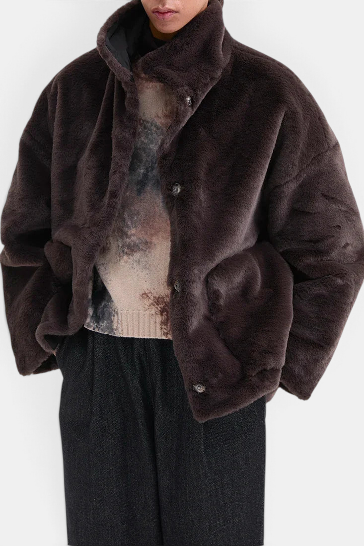 The Copper Shed reversible dark chocolate faux fur jacket with high collar and snap buttons on a model