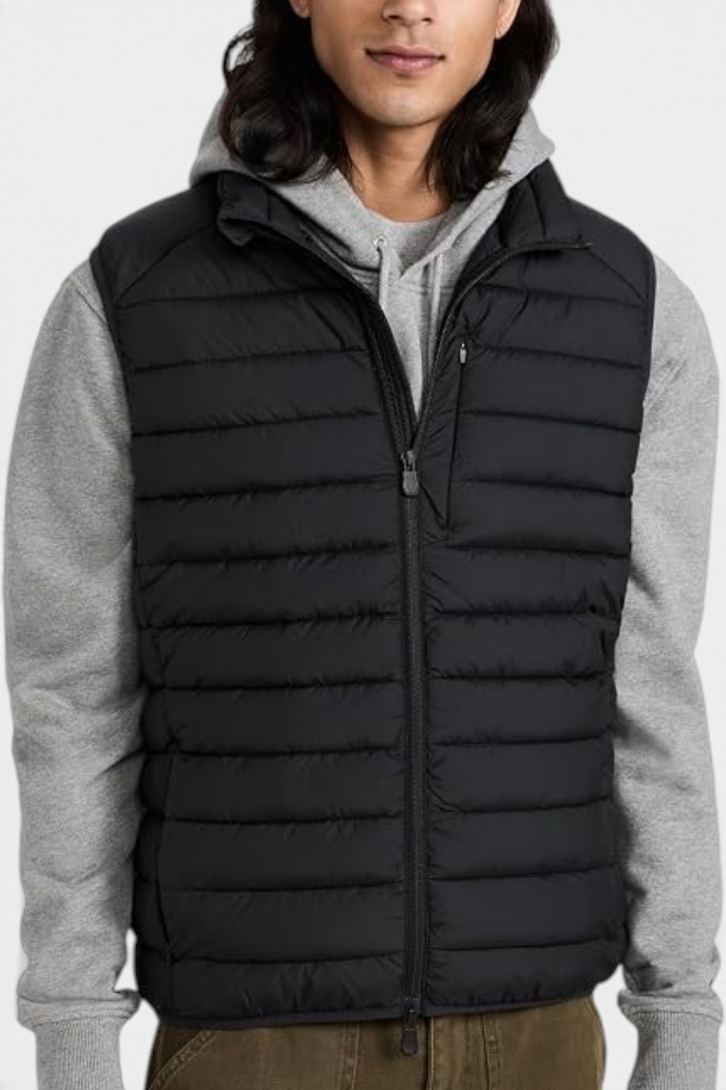 The Copper Shed Rhus black quilted puffer vest with stand-up collar, zippered pockets, and recycled padding.