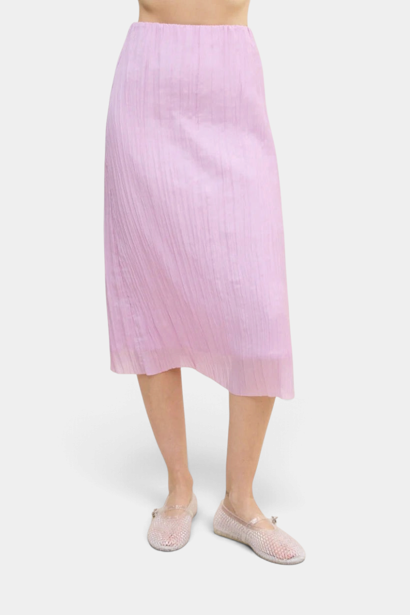 The Copper Shed Sabi Skirt in light pink featuring crinkle-pleated Japanese fabric and an elastic pull-on waistband.