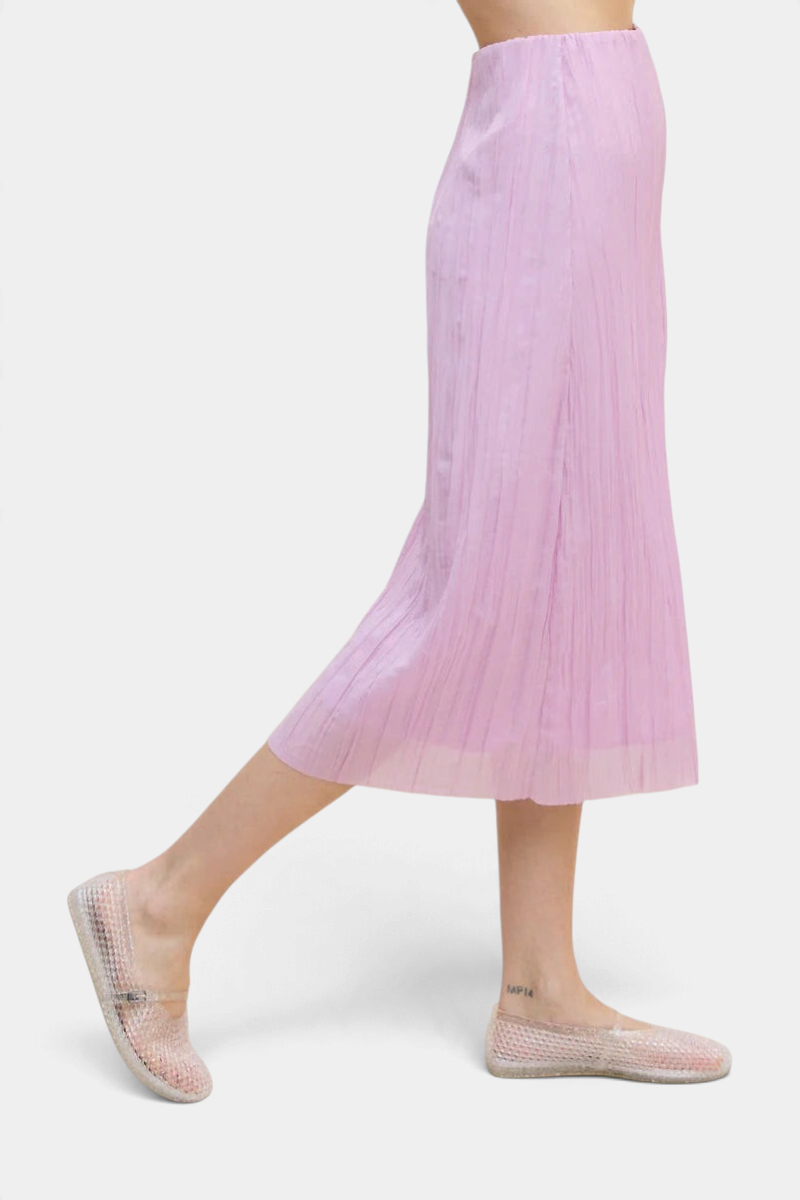 The Copper Shed Sabi midi skirt in light pink crinkle-pleated Japanese fabric with an elastic waistband.