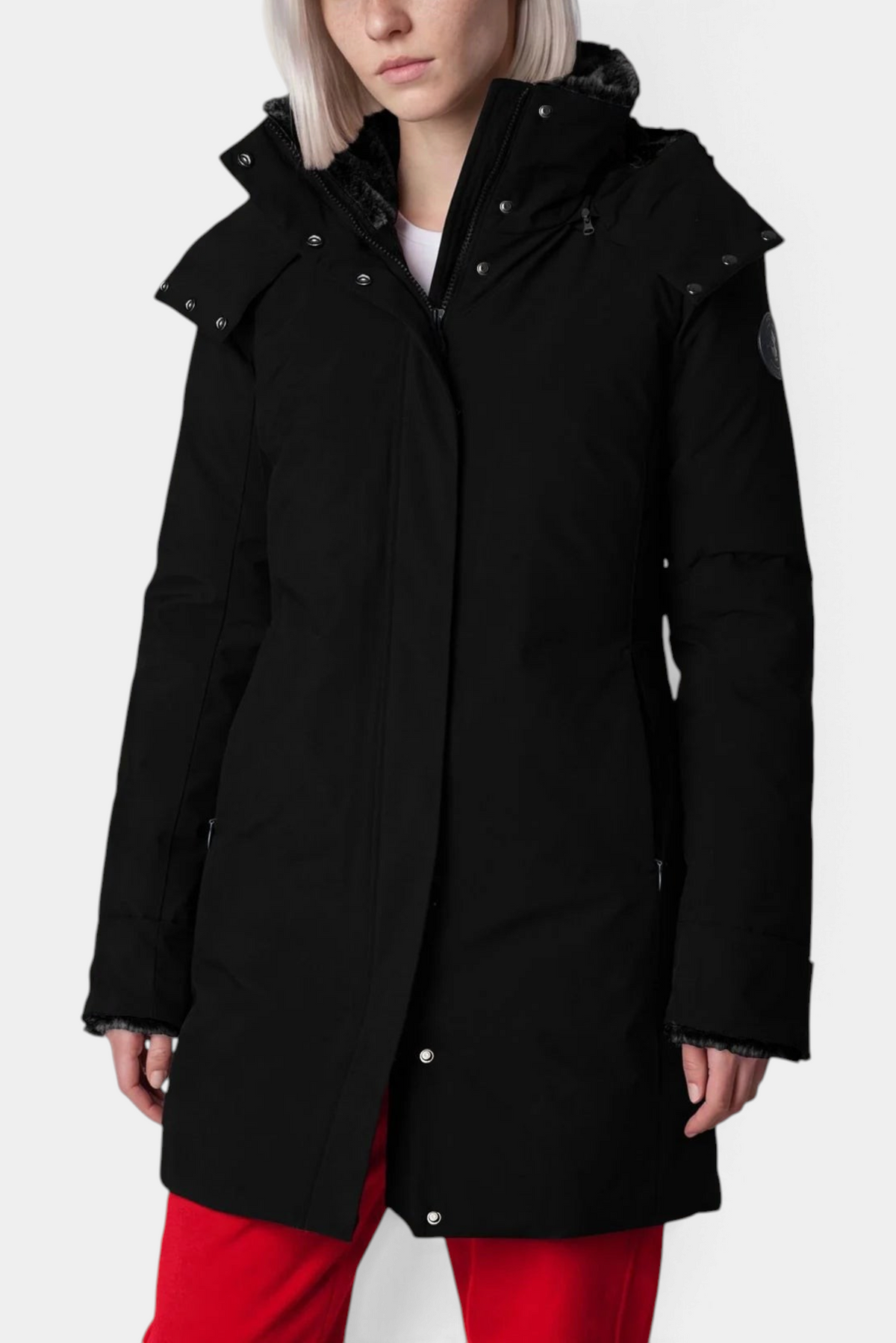 The Copper Shed Samantah Parker jacket in black with a slim fit, hood, and front zip closure worn by a model.