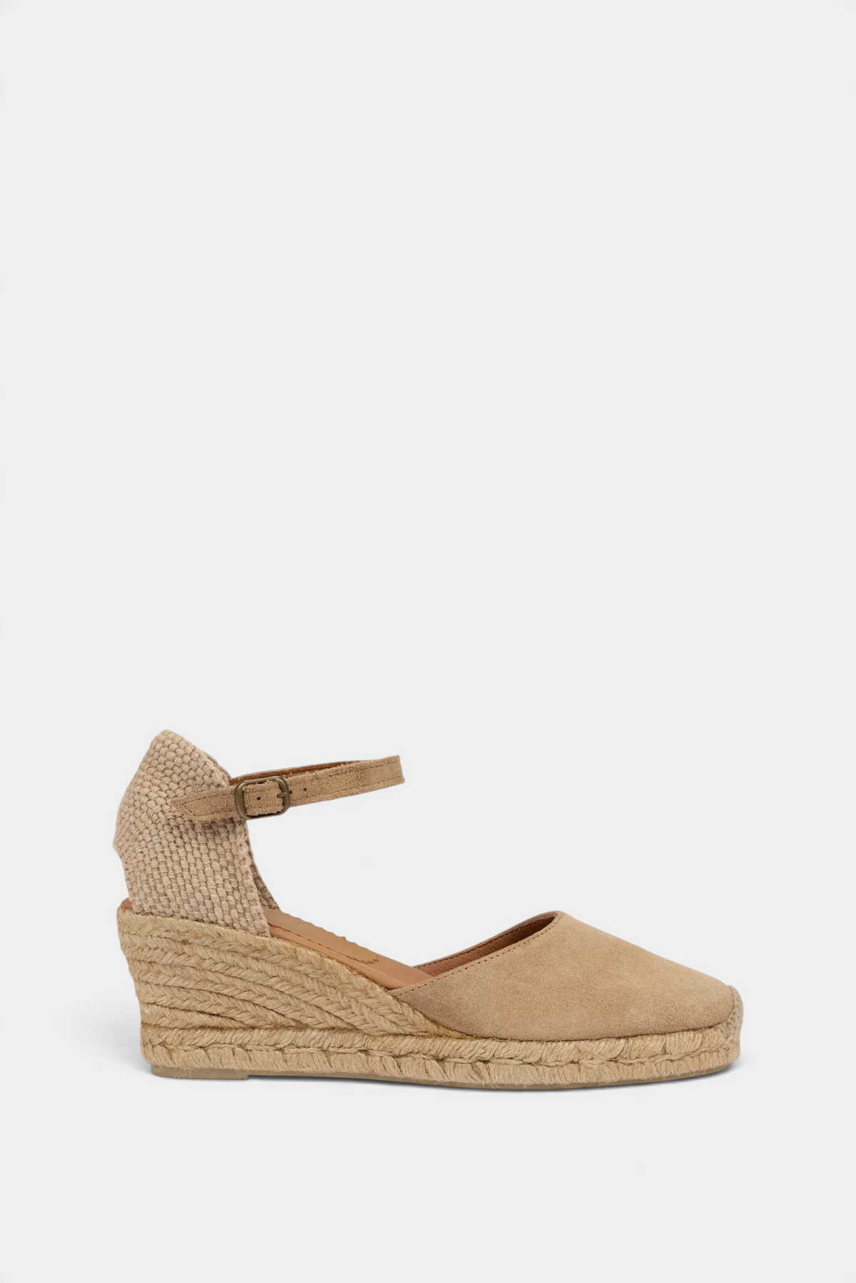 The Copper Shed sand suede Mary Jane espadrille wedge with a buckled ankle strap and hand-stitched jute detailing.
