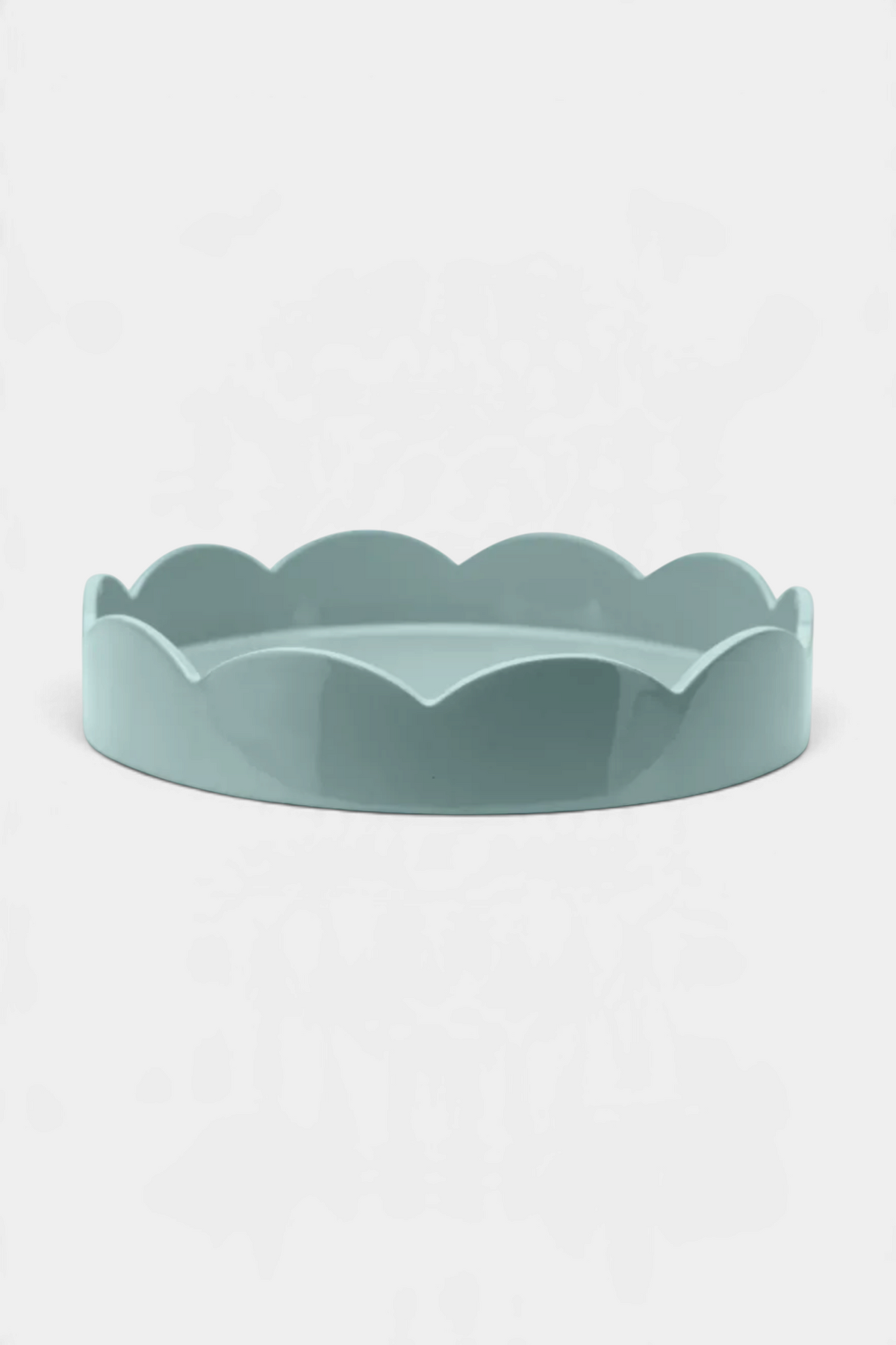 The Copper Shed round scallop tray in a glossy light blue finish with a smooth hand-polished lacquer surface