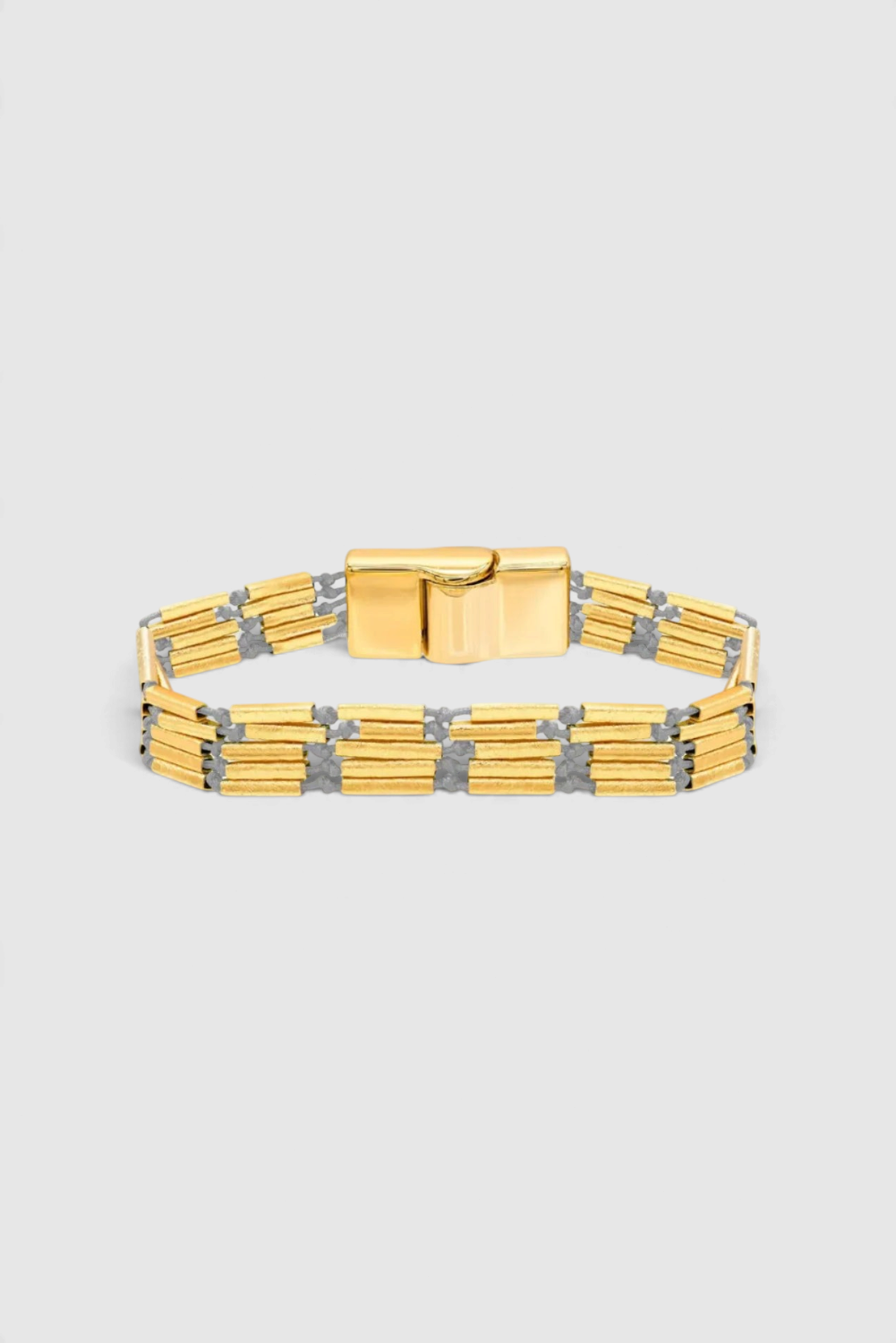 The Copper Shed Seraphine multi-strand bracelet with 18k gold plated cylinder beads and magnetic closure.
