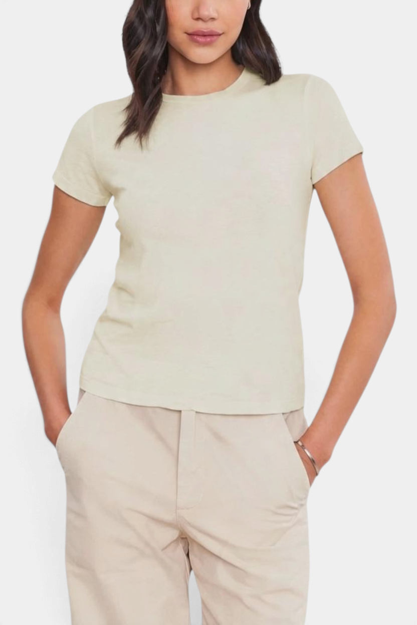 The Copper Shed Sierra short sleeve shirt in cream cotton slub with a shrunken retro fit worn by a model