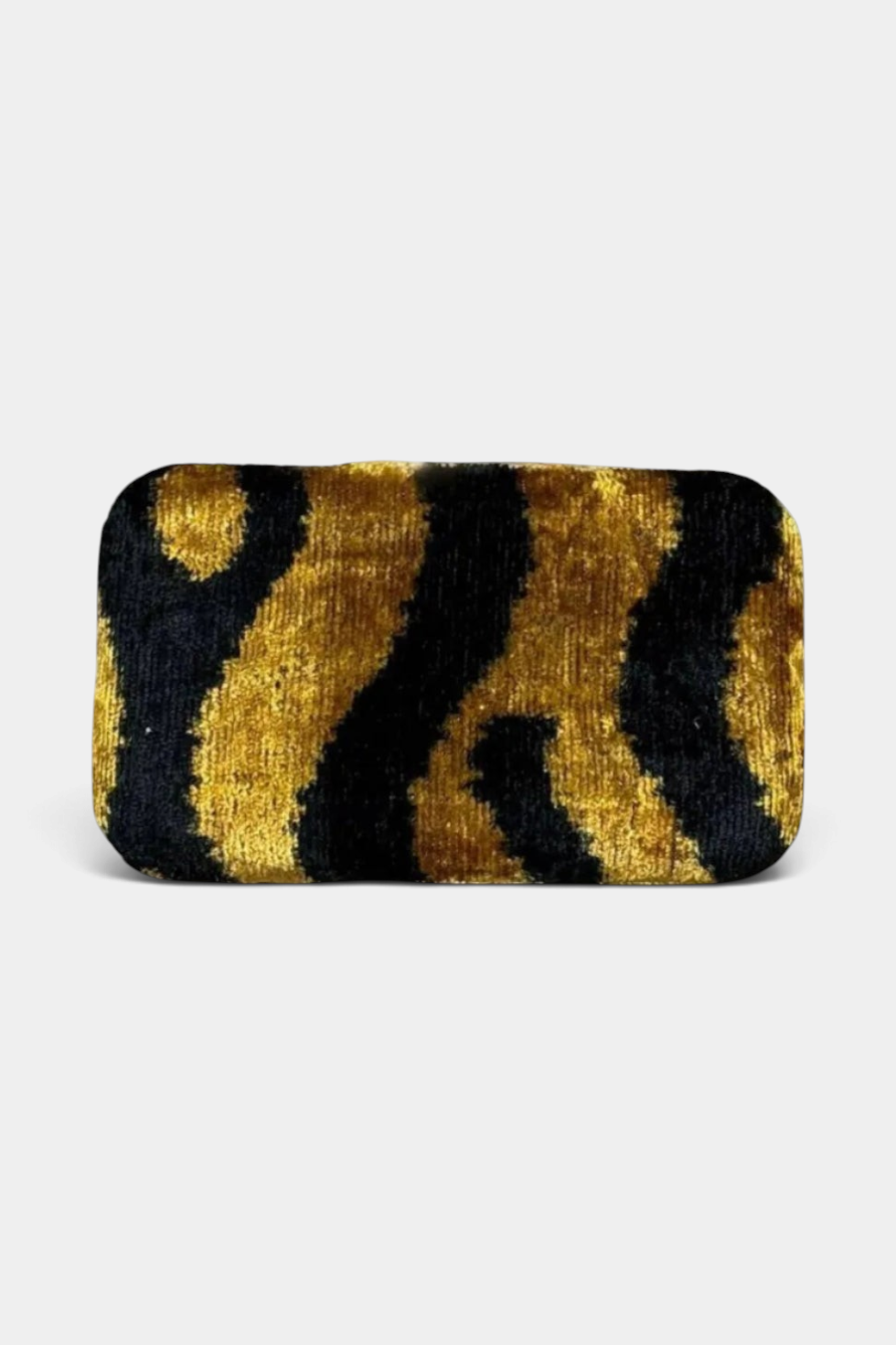 The Copper Shed silk velvet box clutch featuring a black and gold handwoven ikat animal print pattern.