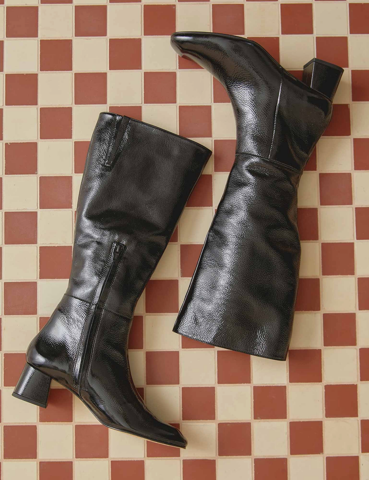 The Copper Shed Sinatra black patent leather knee-high boots with a square toe and mid block heel.