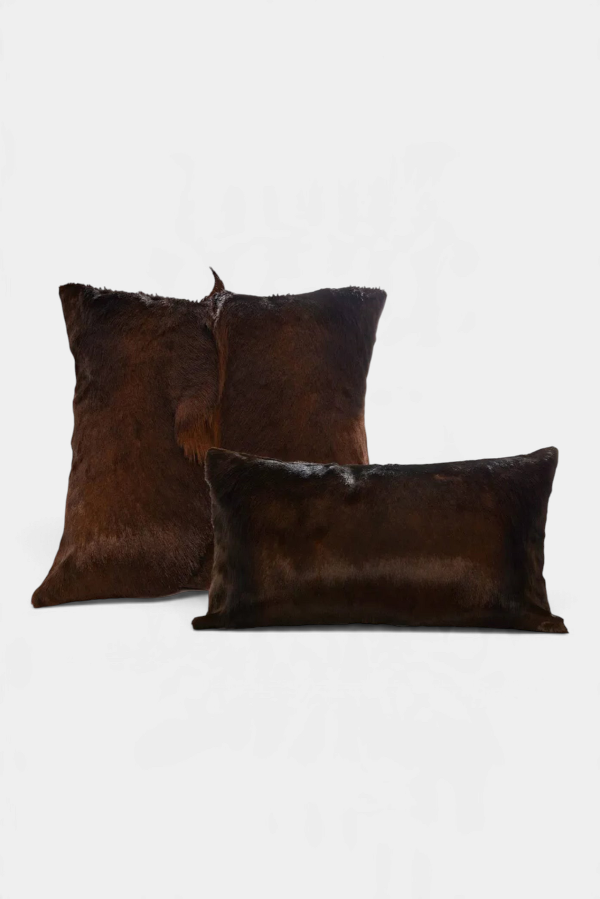 The Copper Shed handmade dark brown genuine springbok fur pillows with plush ultra-suede backing and feather down fill