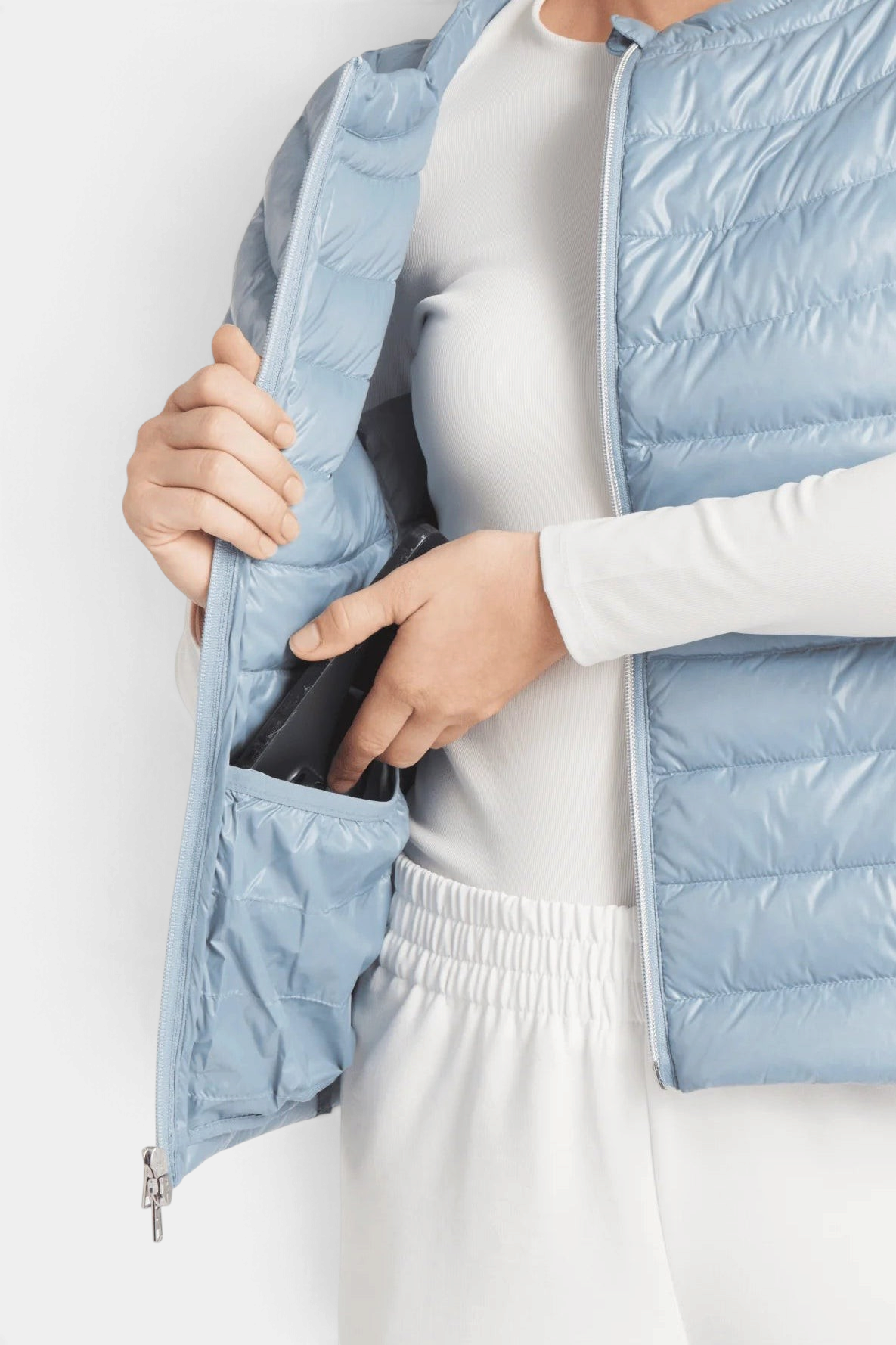 The Copper Shed St Ives light blue packable down vest with a 2-way zipper and hidden side pocket